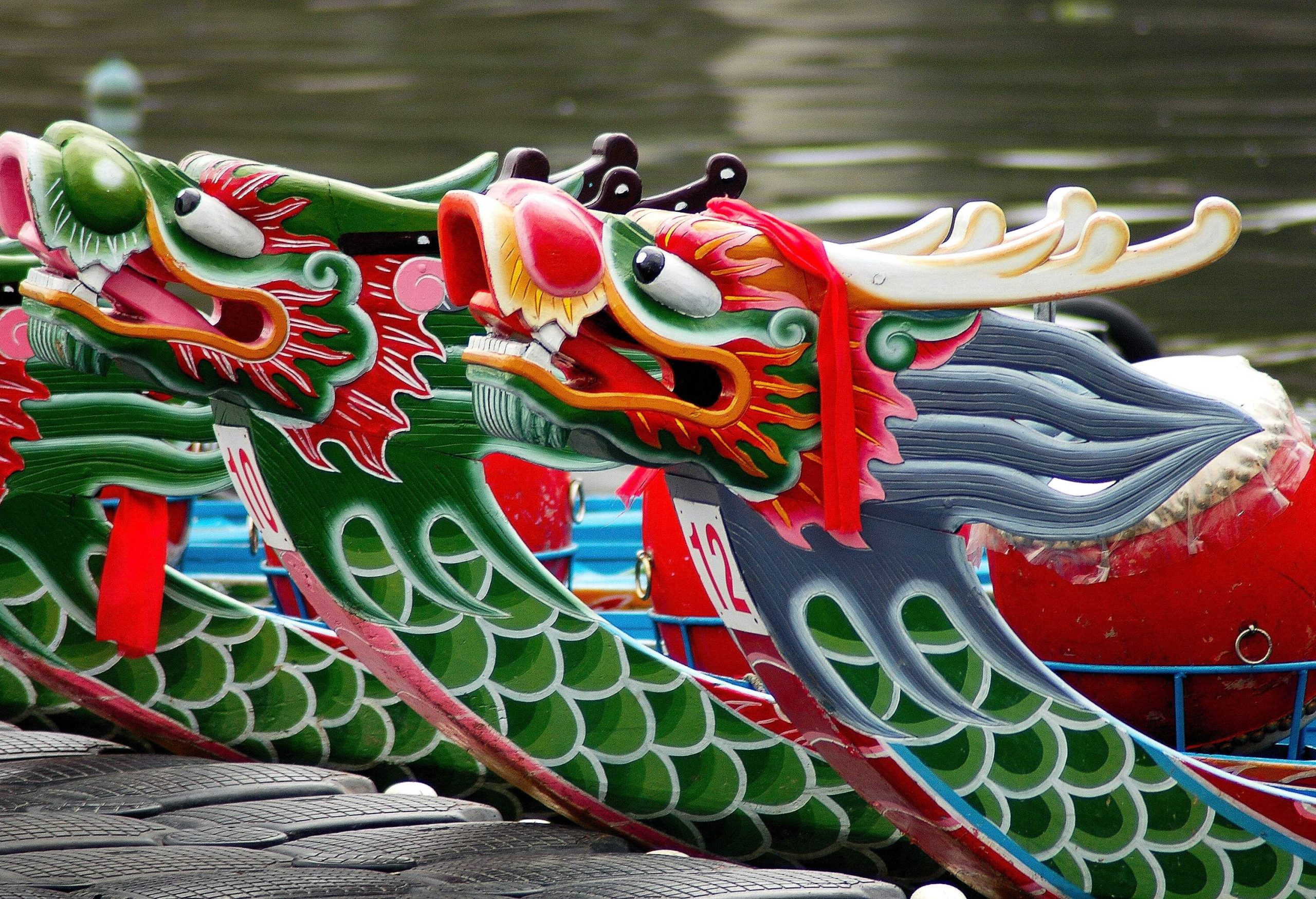 Dragon boats find rest as they moor along the calm waterways.