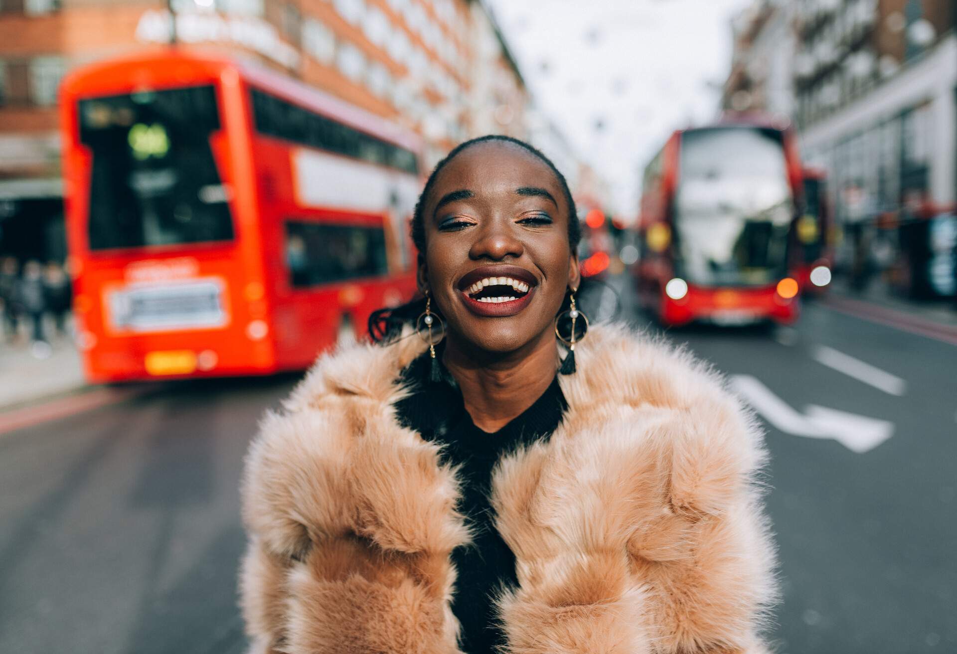 DEST_UK_ENGLAND_LONDON_PEOPLE_WOMAN_LAUGHING_OXFORD_STREET_BUS_GettyImages-1054835750 copy