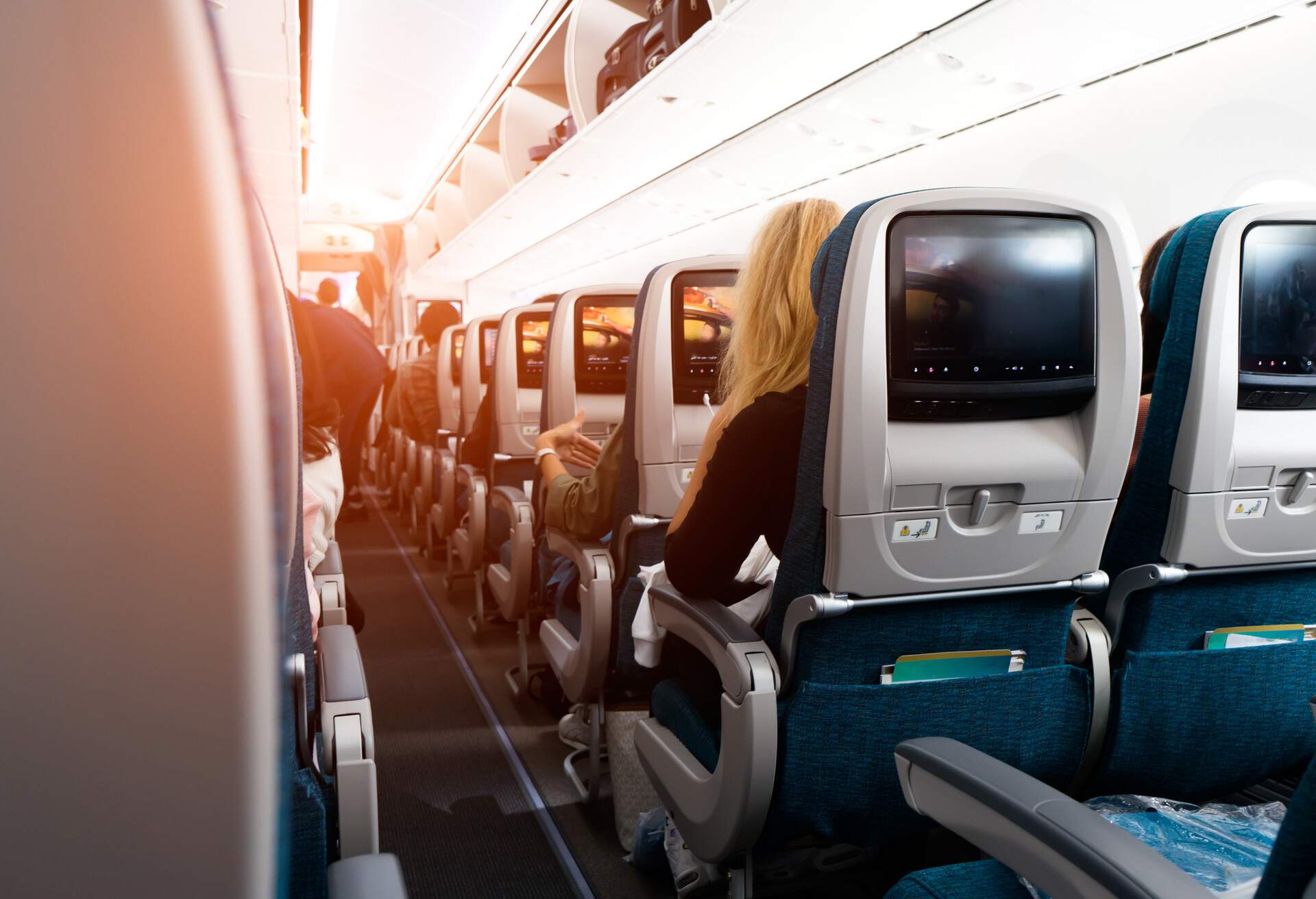 Passengers on board a commercial aircraft settled into their seats.