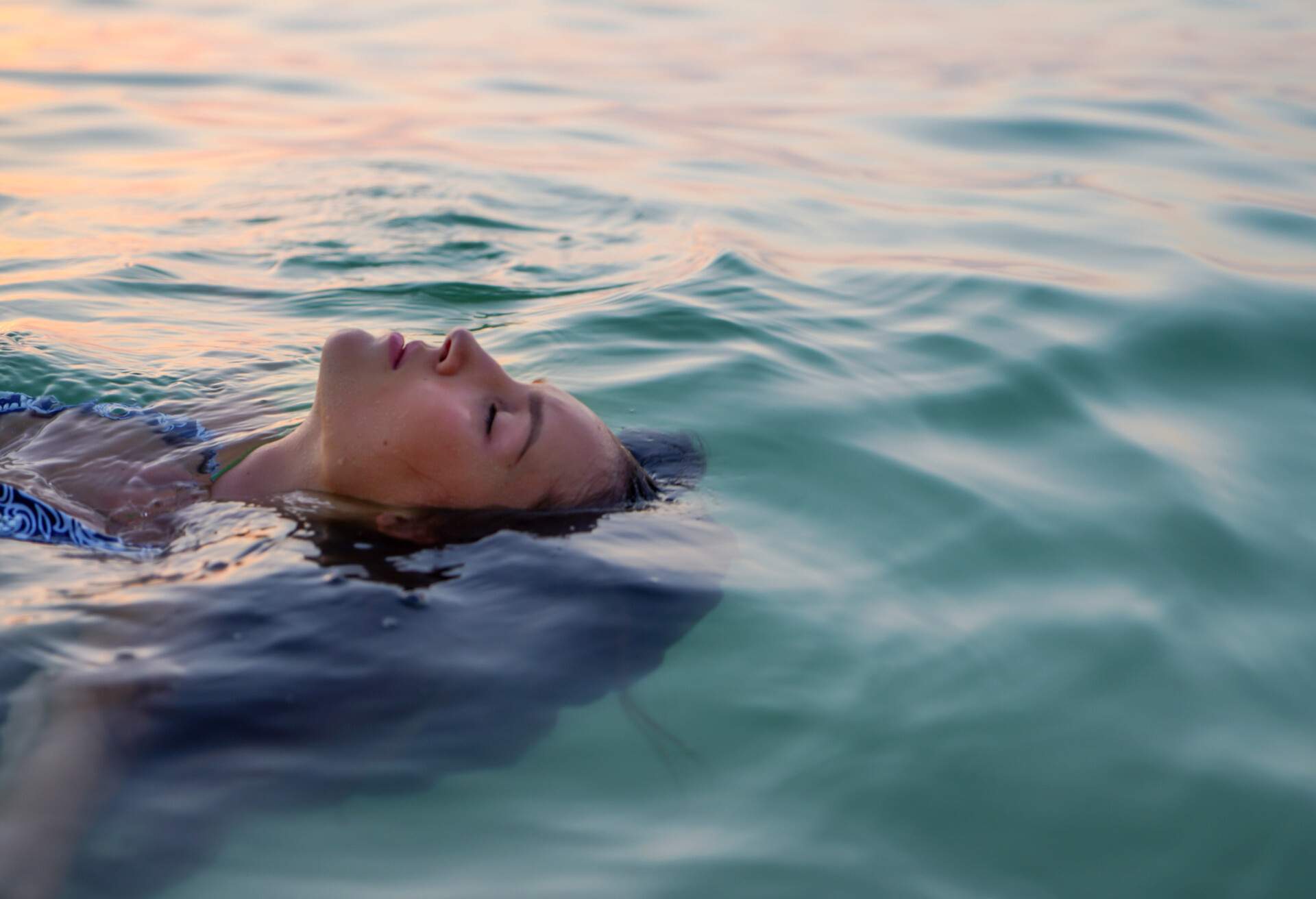 woman floating and relaxing in the water