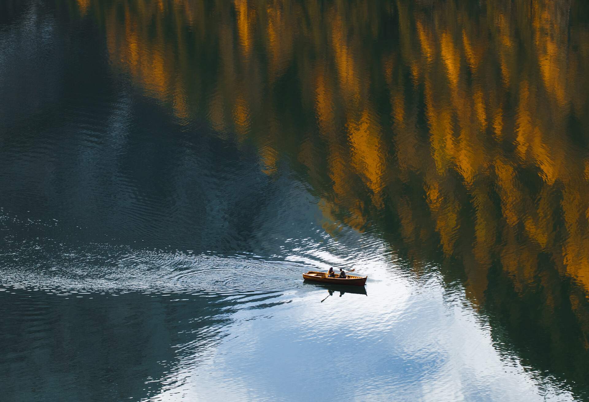 autumn landscape with mirror reflection in clear water surface from above