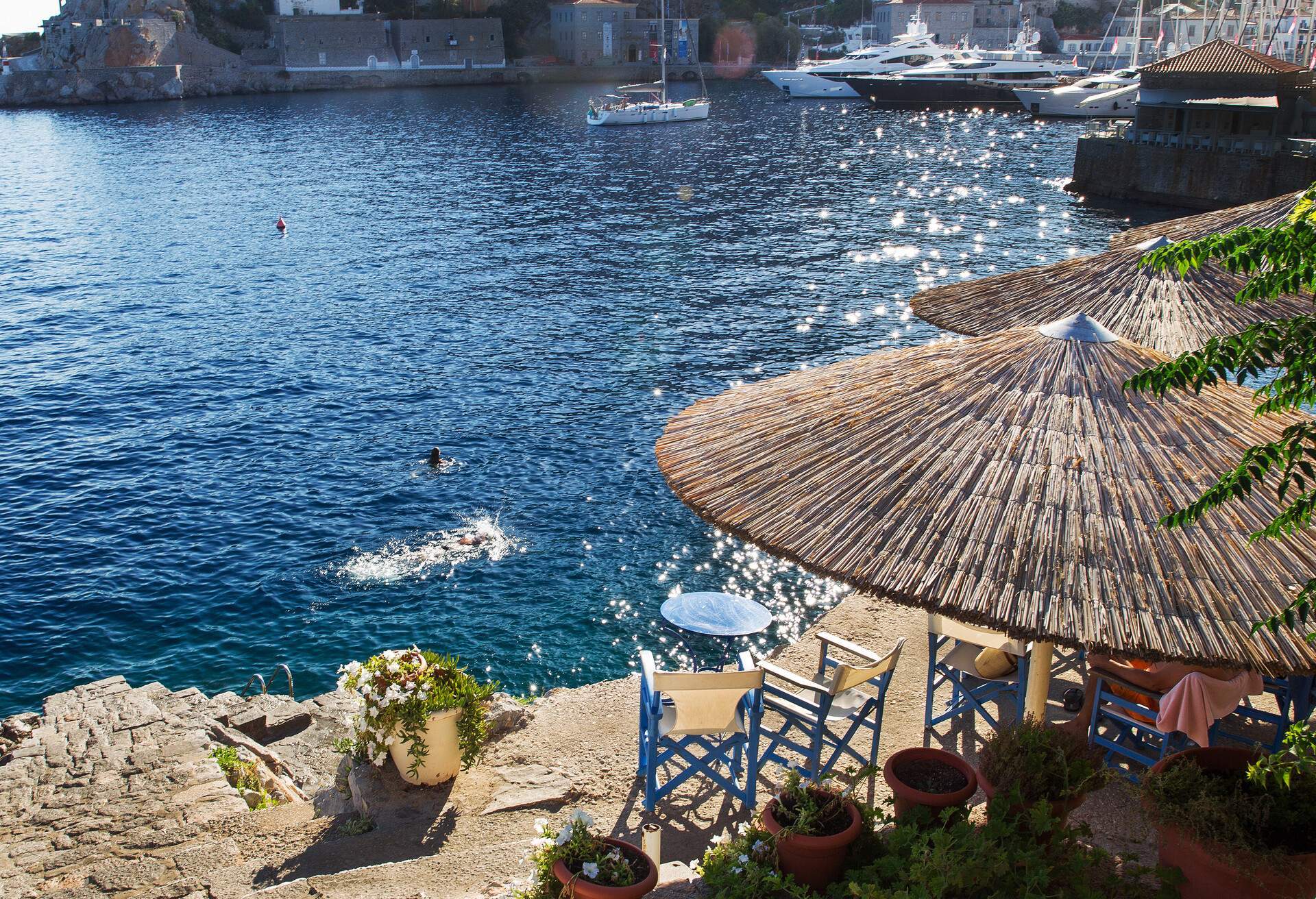 People swimming in Hydra, Greece.