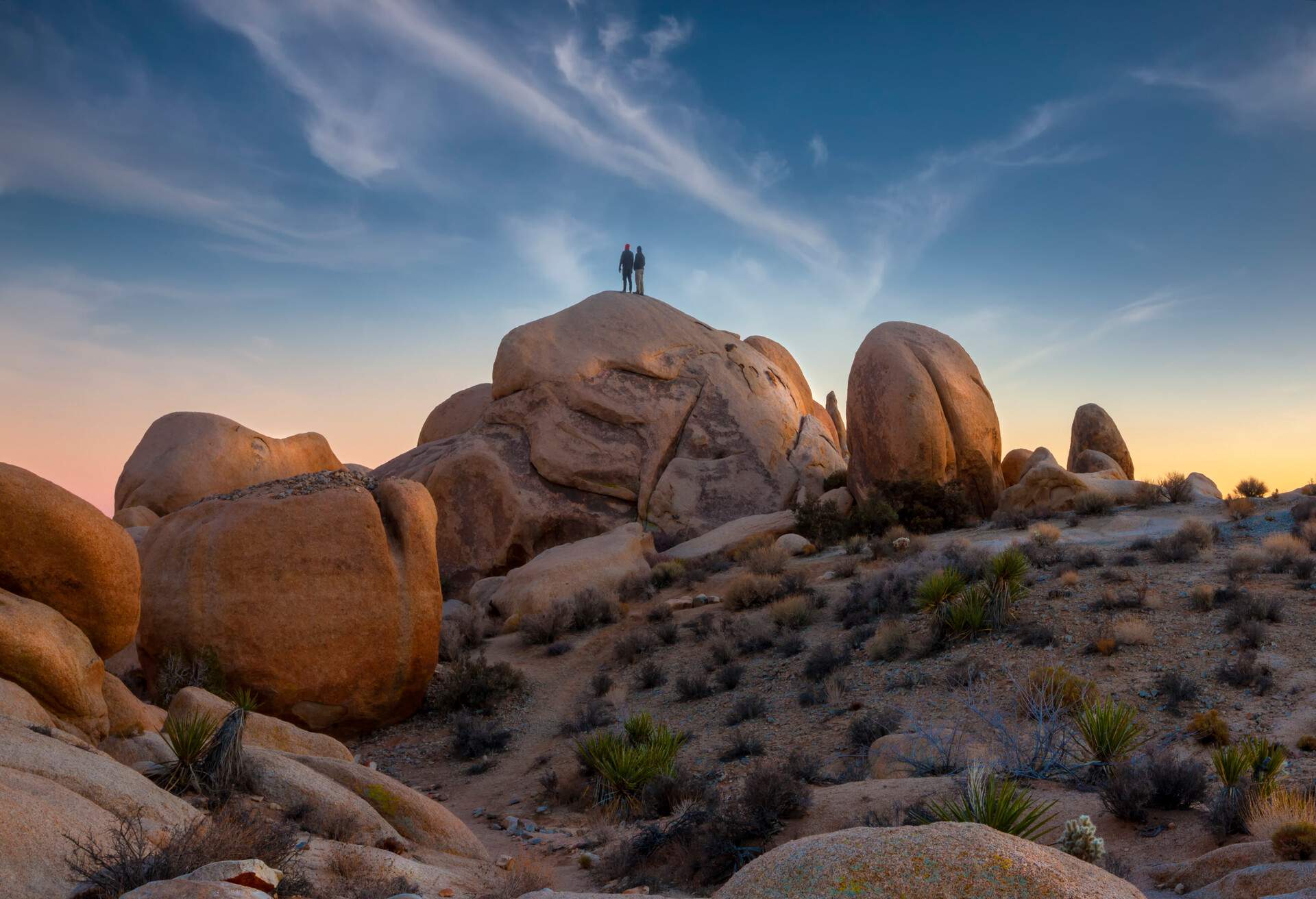 Two campers enjoying the late afternoon view from Joshua Tree National Park.