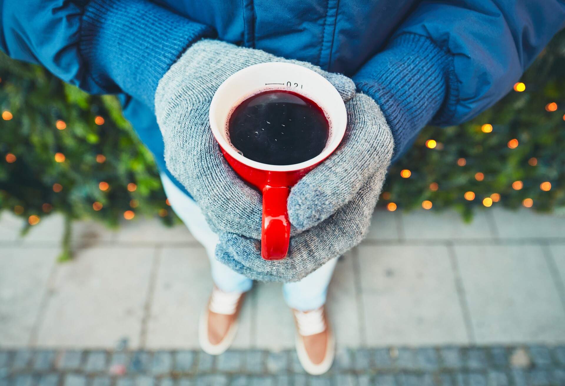 Person holding mulled wine.