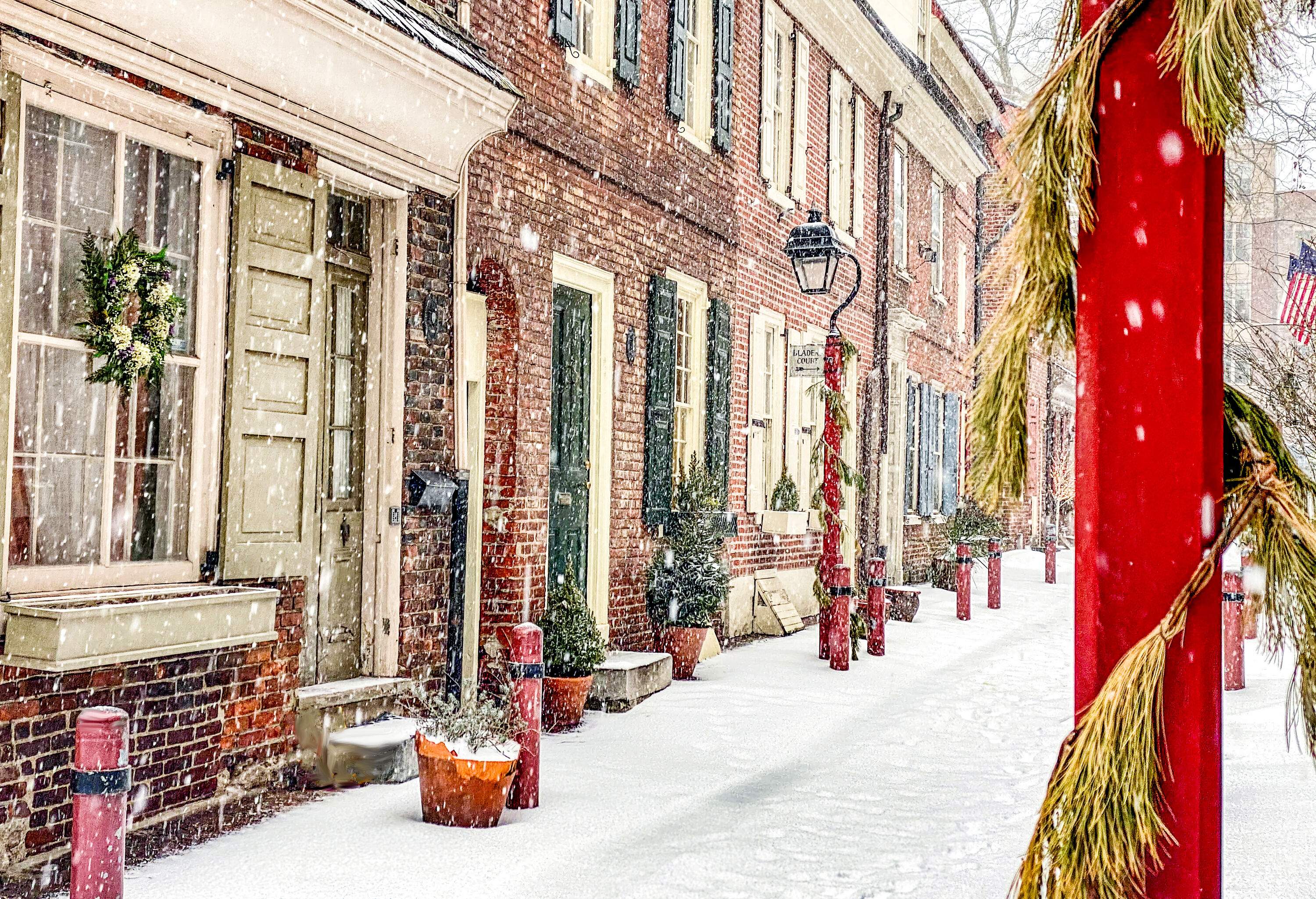 Center city Philadelphia. Elfreth Alley street in the winter, covered with white snow.