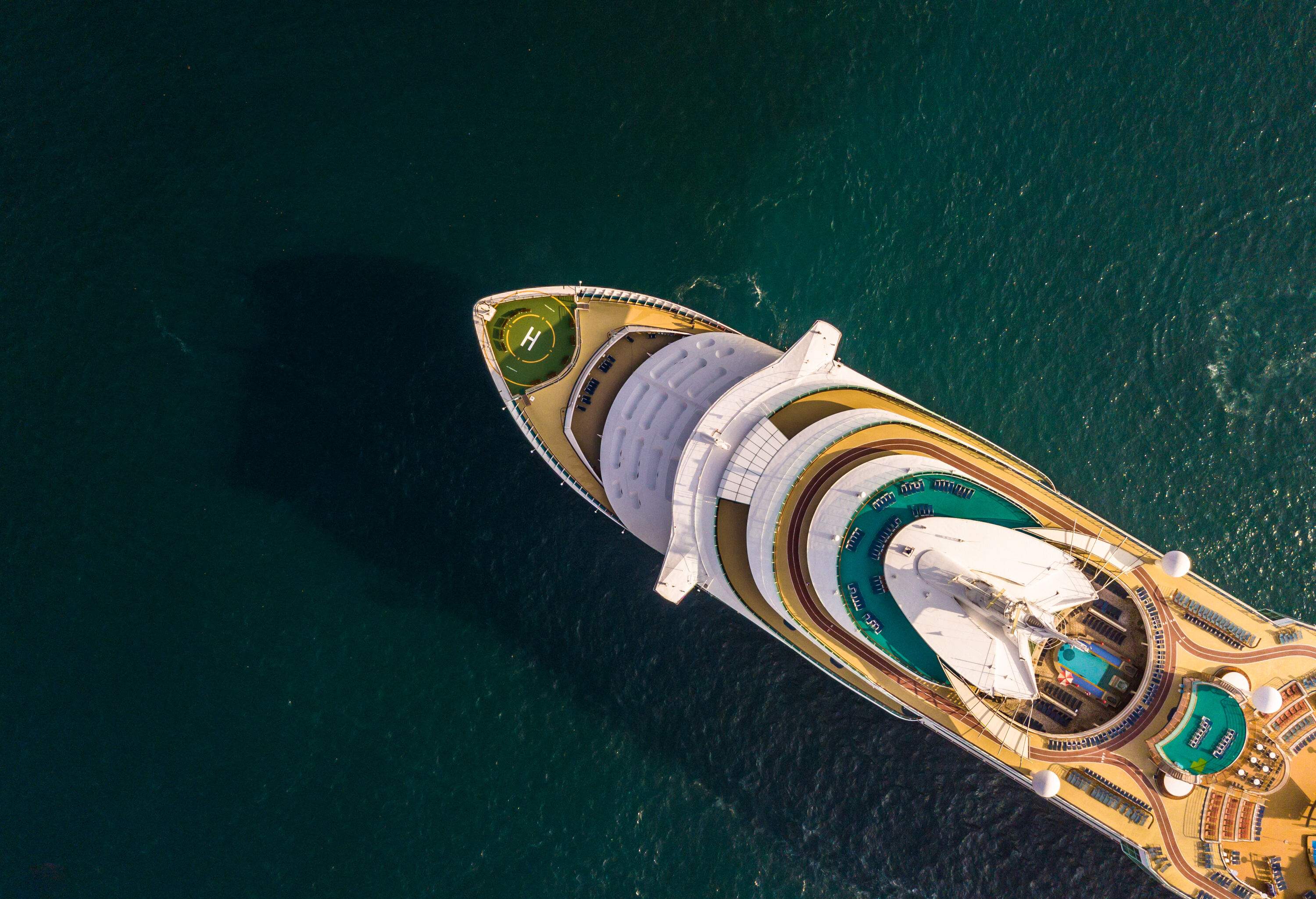 A big cruise ship sailing across an ocean.