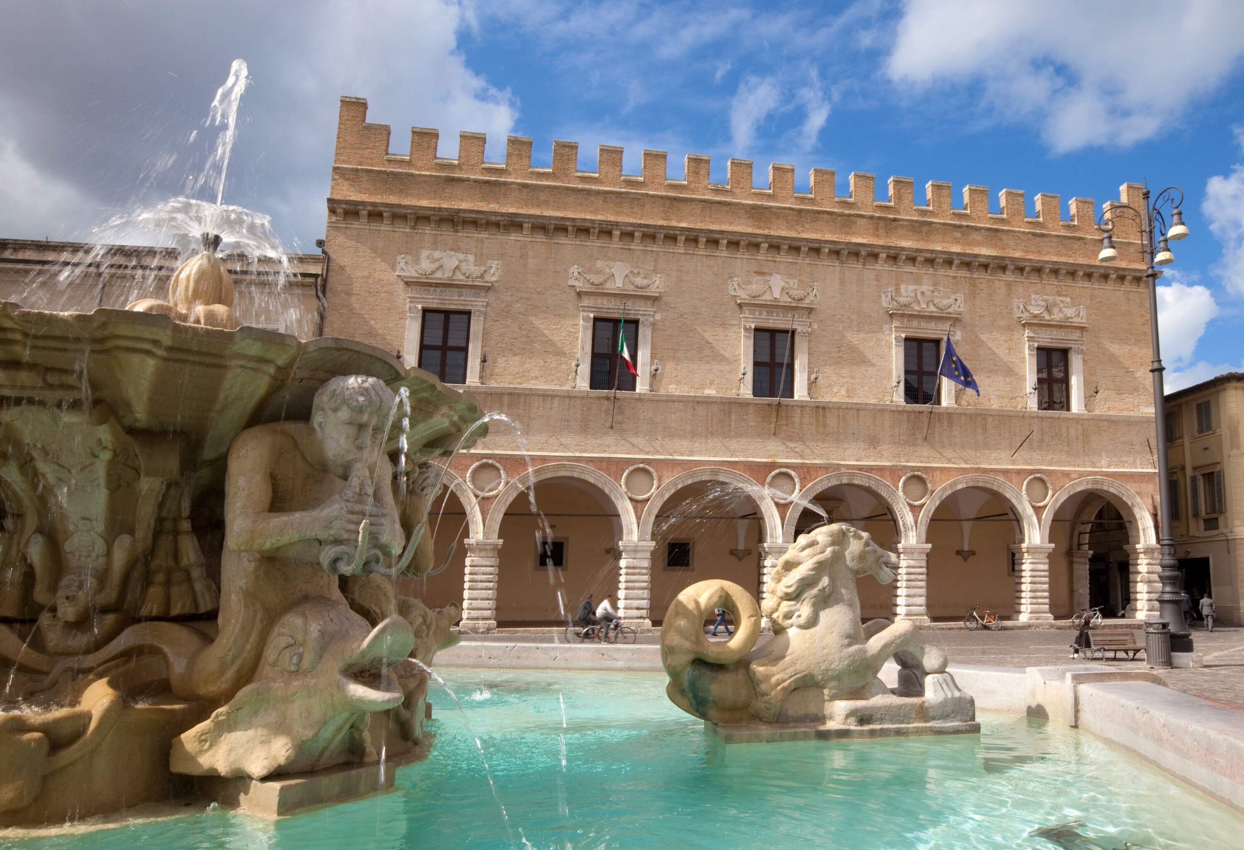 Fountain and Renaissance palace in Pesaro, Marches, Italy.