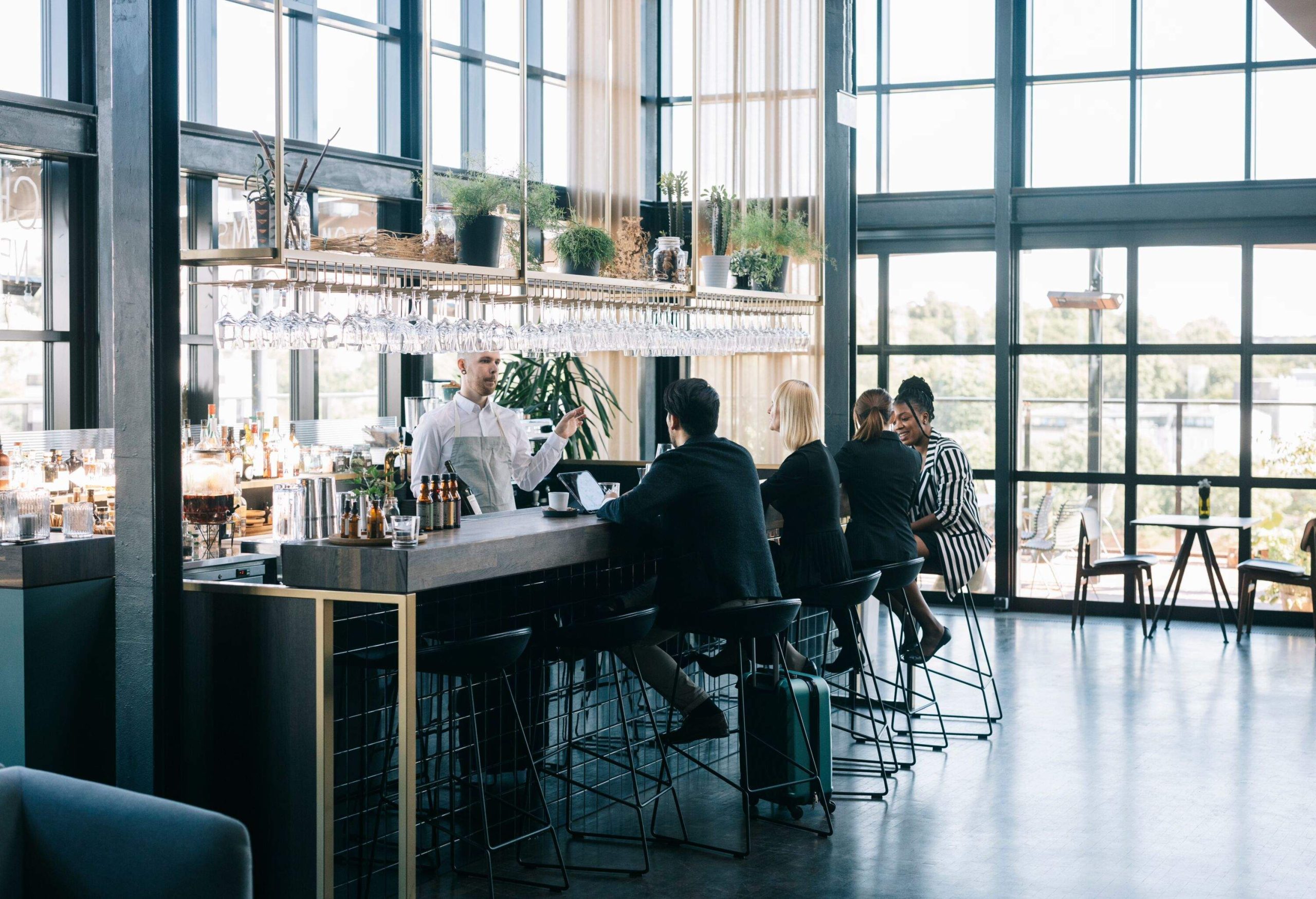 Group of people at the airport business class bar