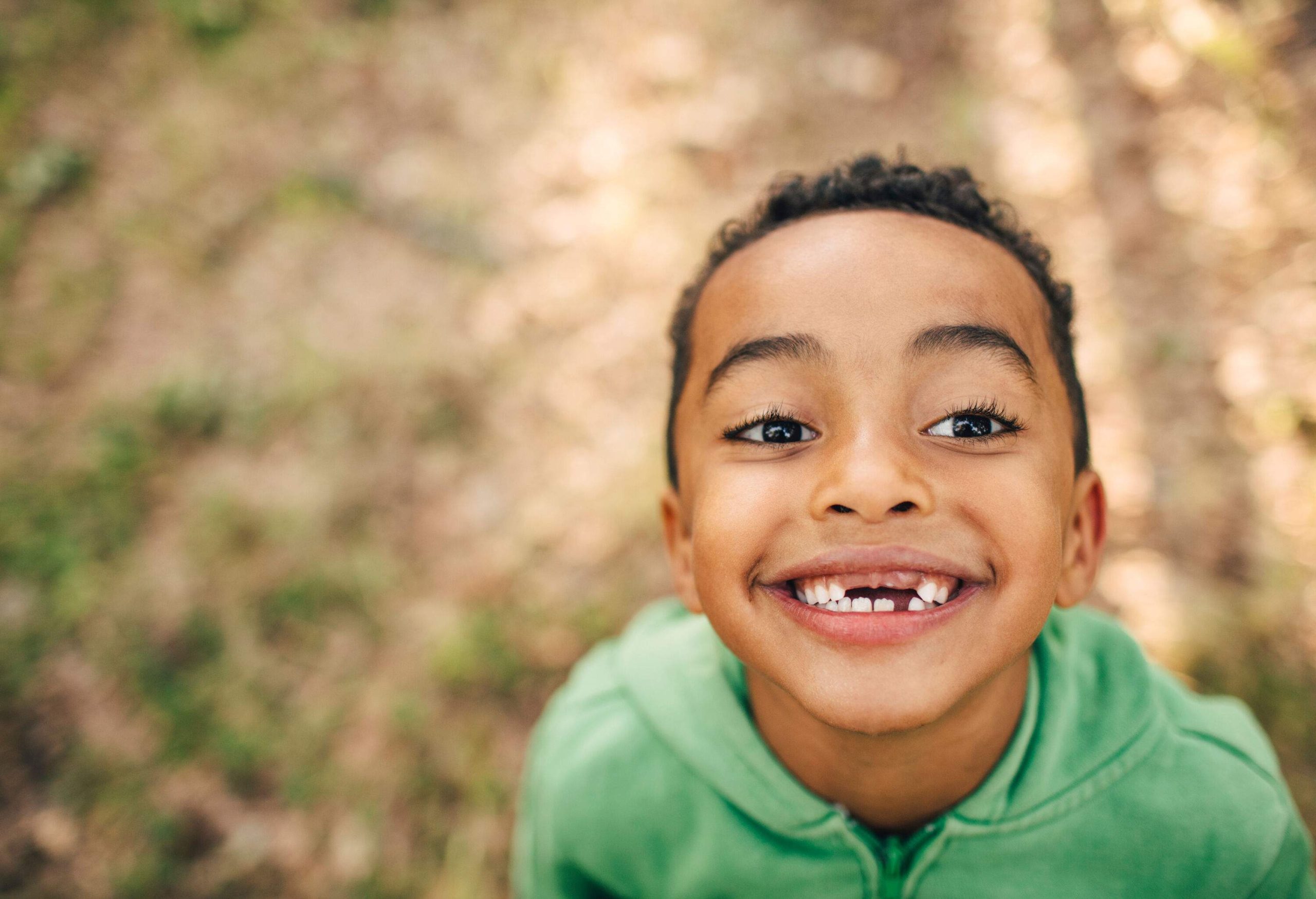 Portrait of a happy little boy with gaps in his teeth.