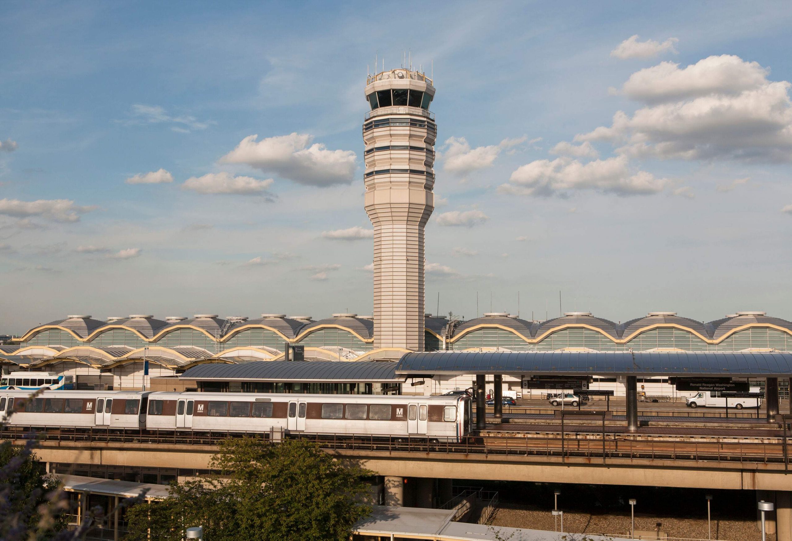 The control tower of Reagan National Airport rises majestically above the bustling terminal, while the nearby Washington Metro adds a touch of urban connectivity, creating a seamless transportation hub for travellers.