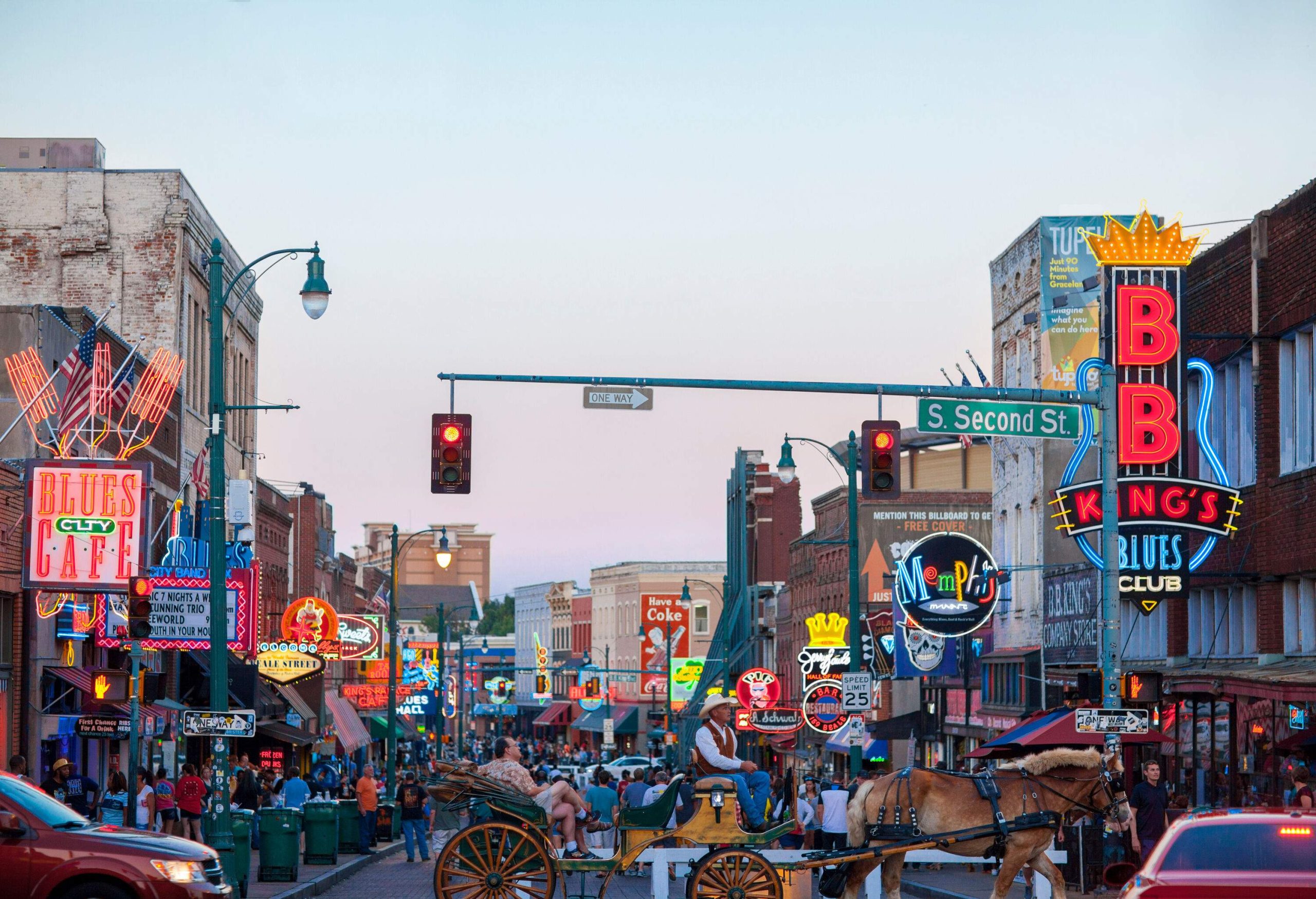 Clubs and restaurants line the iconic bustling downtown street visited by many tourists.