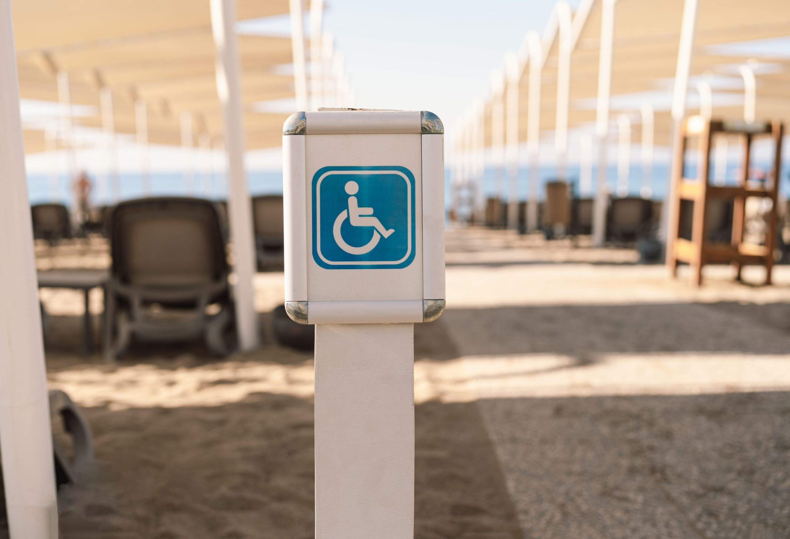 Disability sign on the sea beach. Beach places for people with disabilities. The sign for the disabled there are places for people with disabilities.