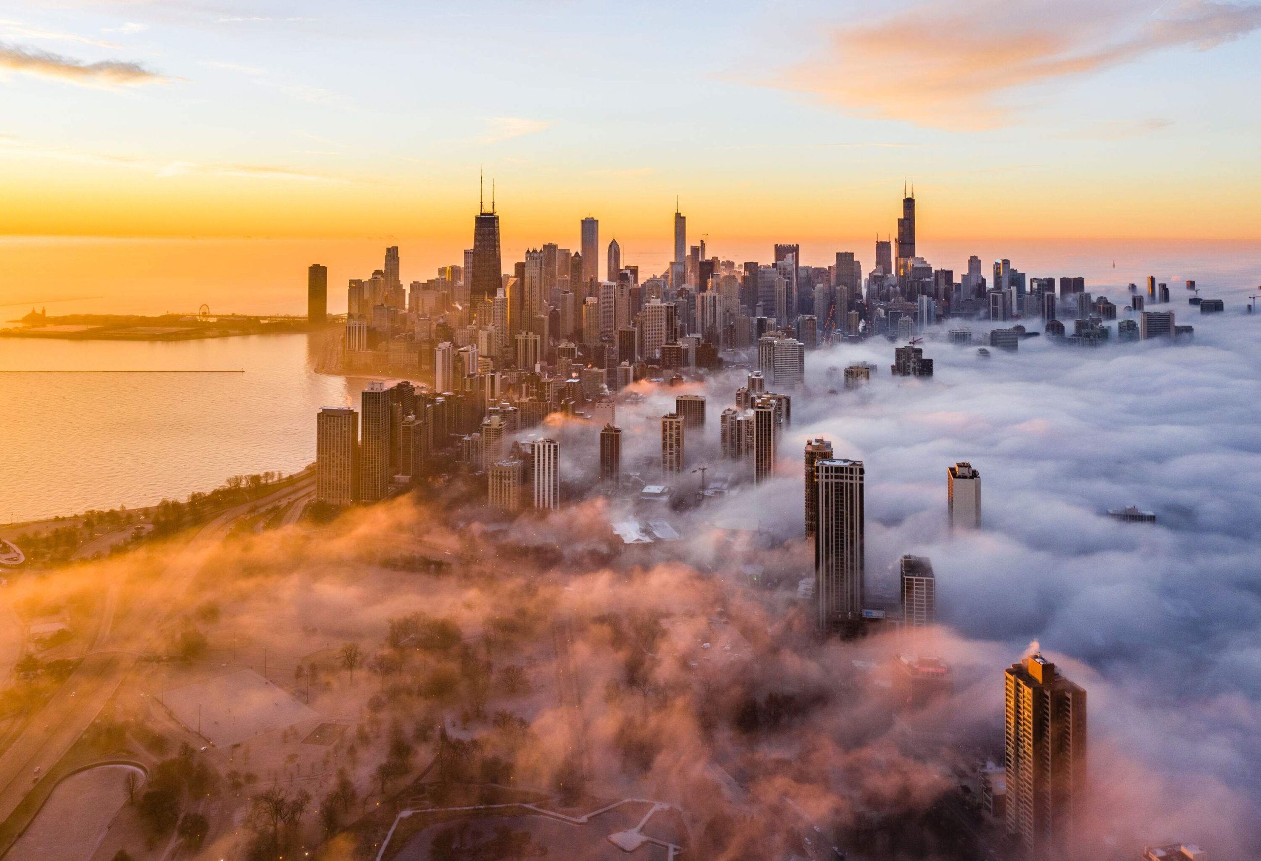A picturesque skyline of a modern city, featuring towering skyscrapers partially shrouded in a sea of clouds, set against the backdrop of a scenic twilight sky, creating a mesmerizing urban landscape.
