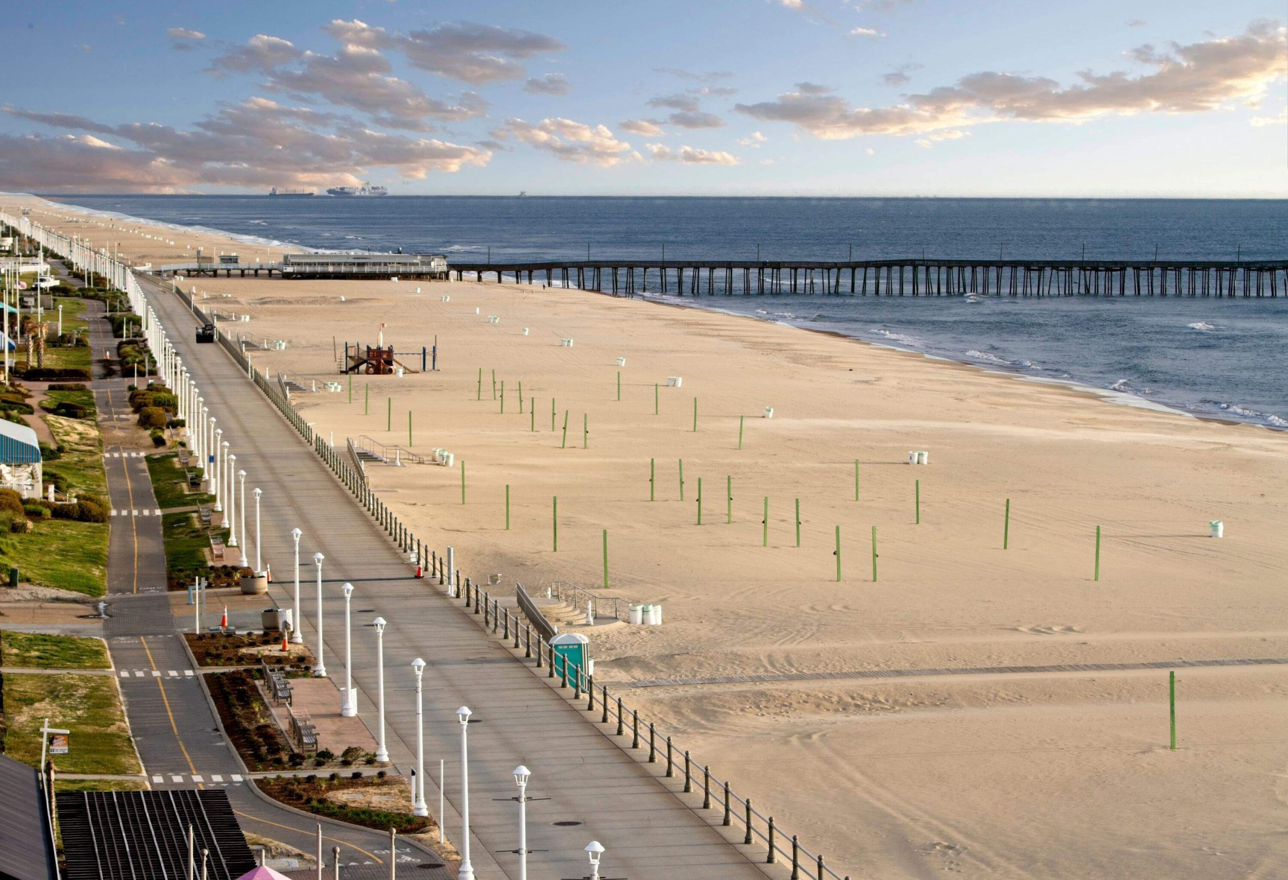 Virginia beach and the boardwalk during the early light of morning.