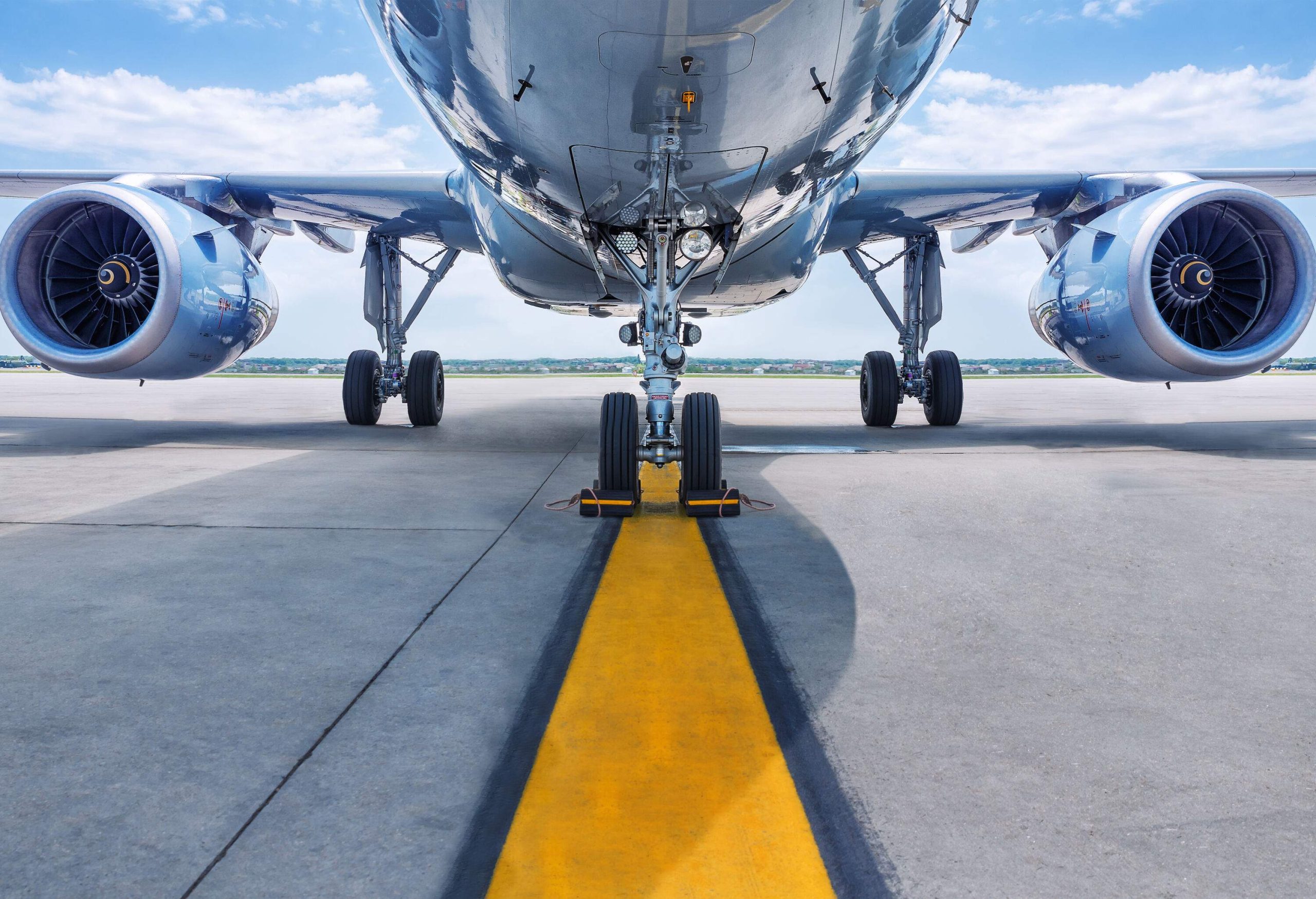 Turbines of an aircraft idling steadily over the runway.