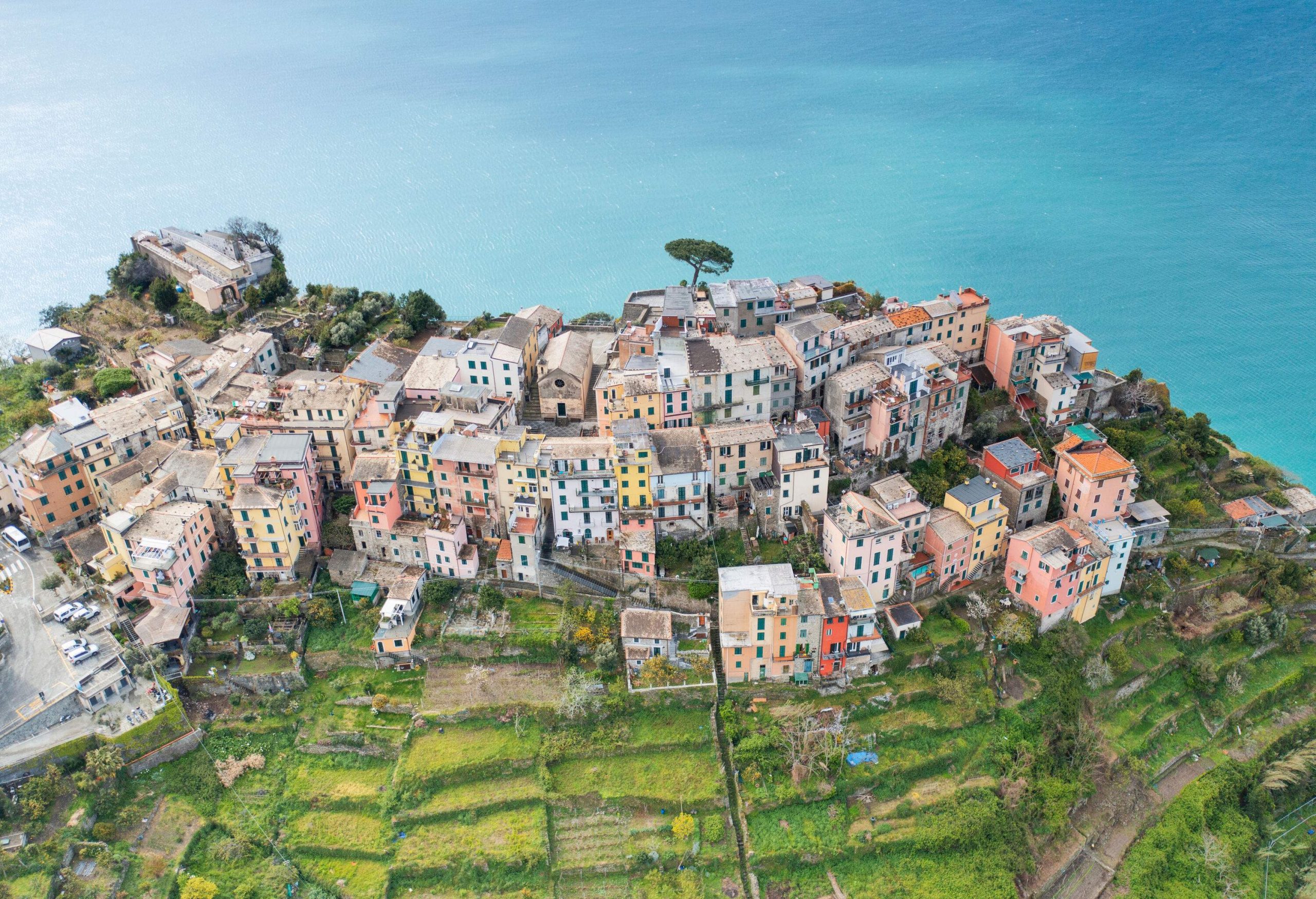 A spectacular view of the picturesque village with colourful houses set on a cliff overlooking the ocean.
