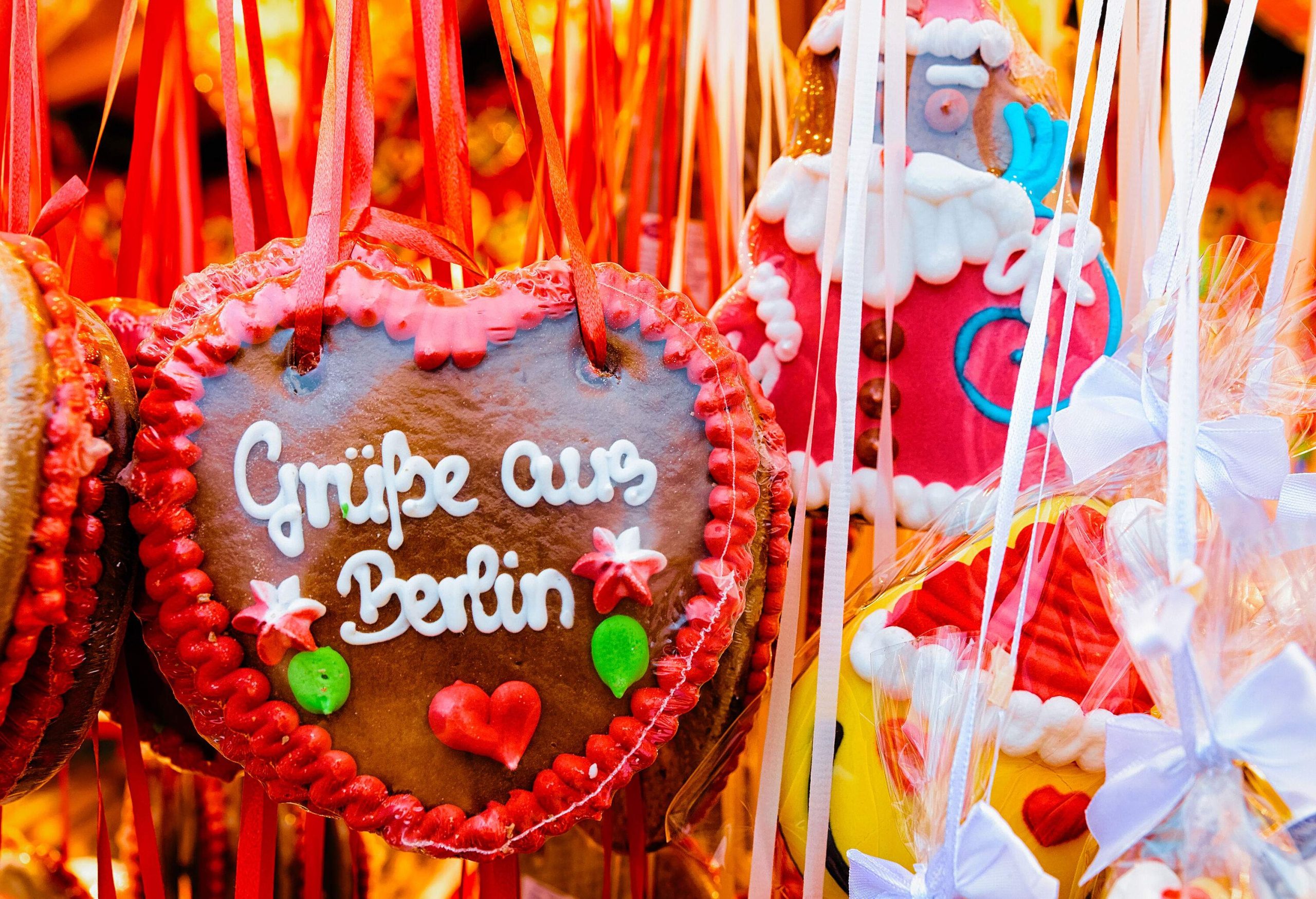 Heart shape Gingerbread cookies food on Christmas market in Europe in winter. German Night street Xmas and holiday fair in European city or town, December. Gendarmenmarkt in Berlin, Germany