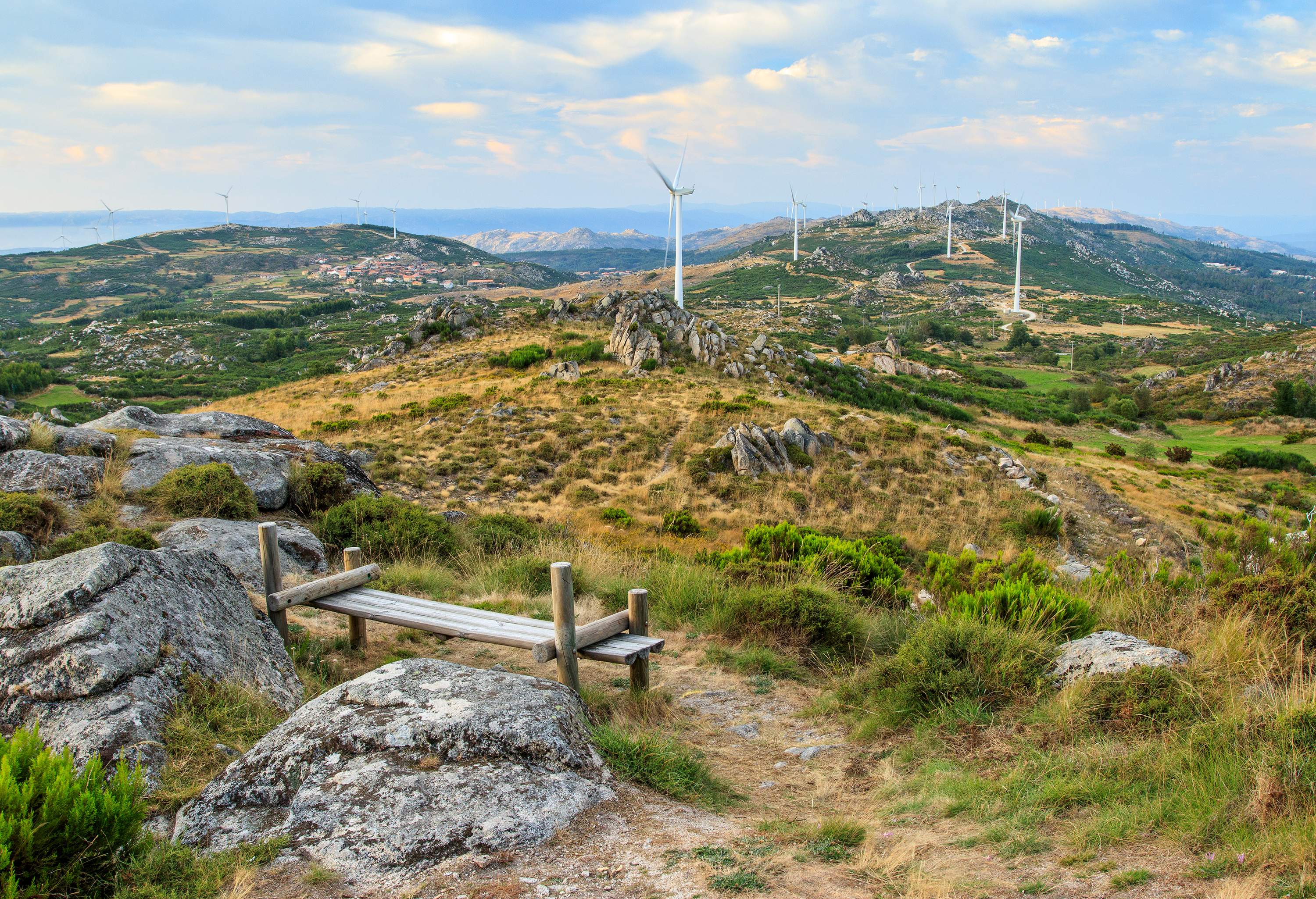 Viewing point of mountains with windmills