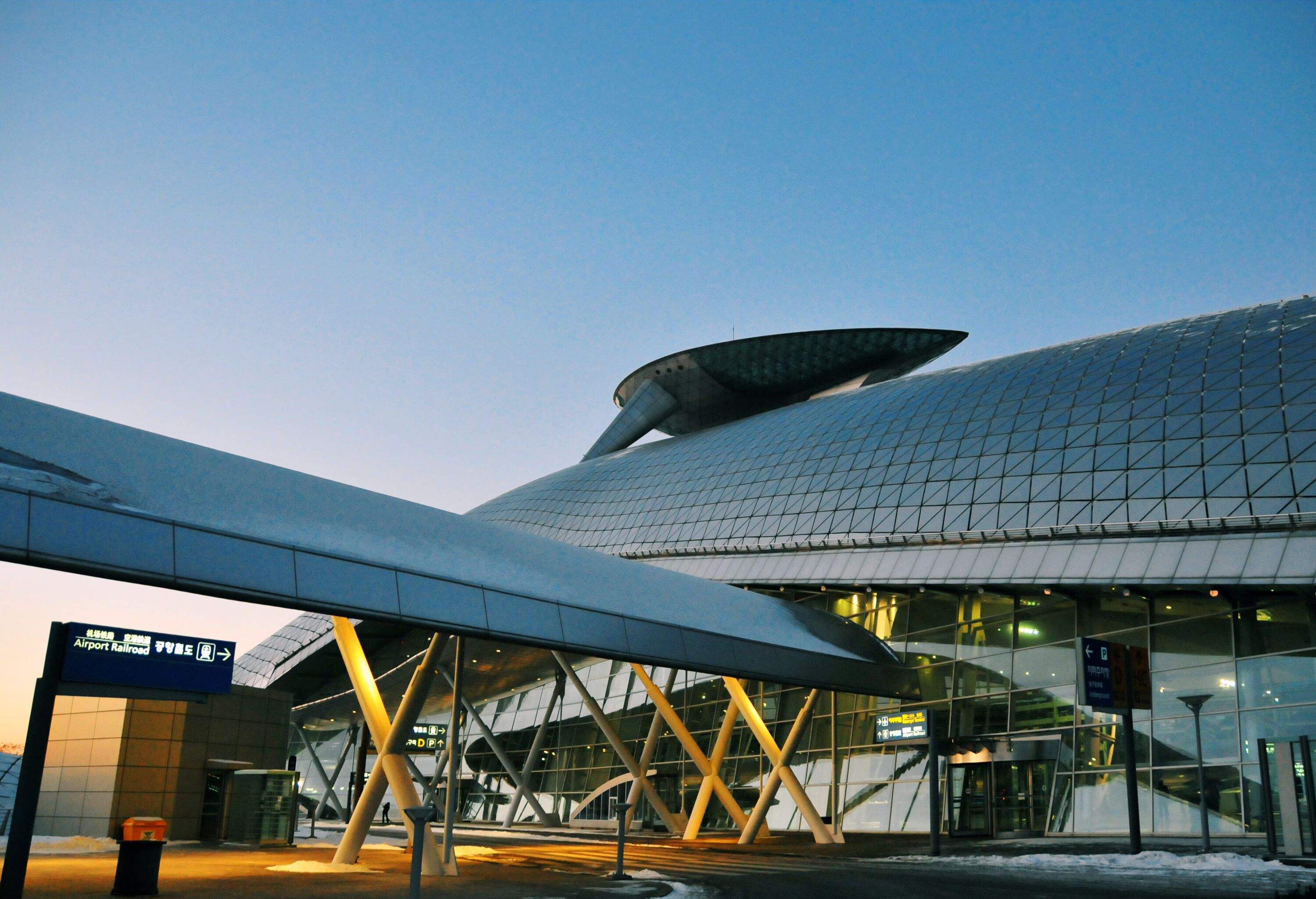 View of main airport building at a major asian flight hub at dusk