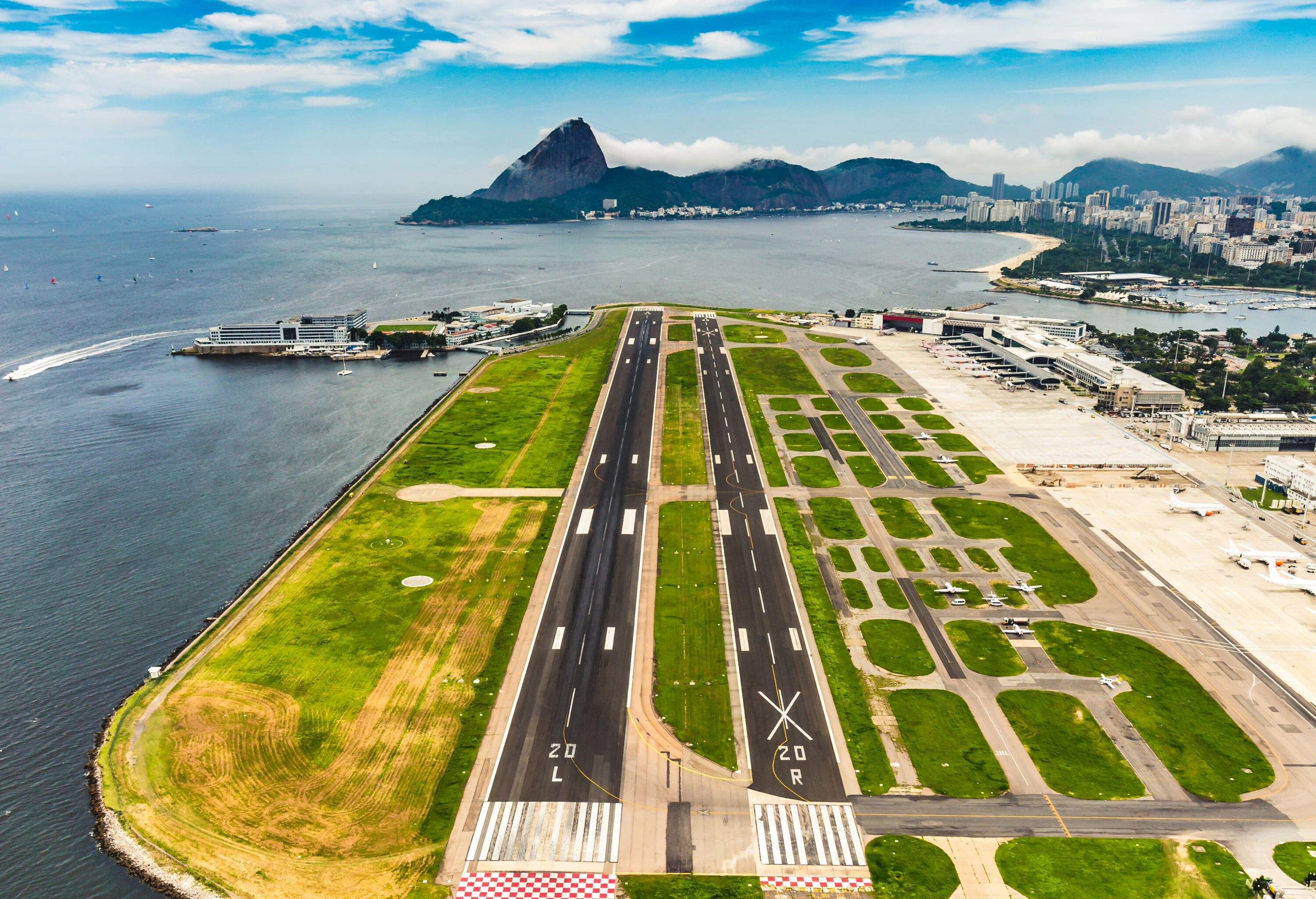 A coastal airport with two runways.
