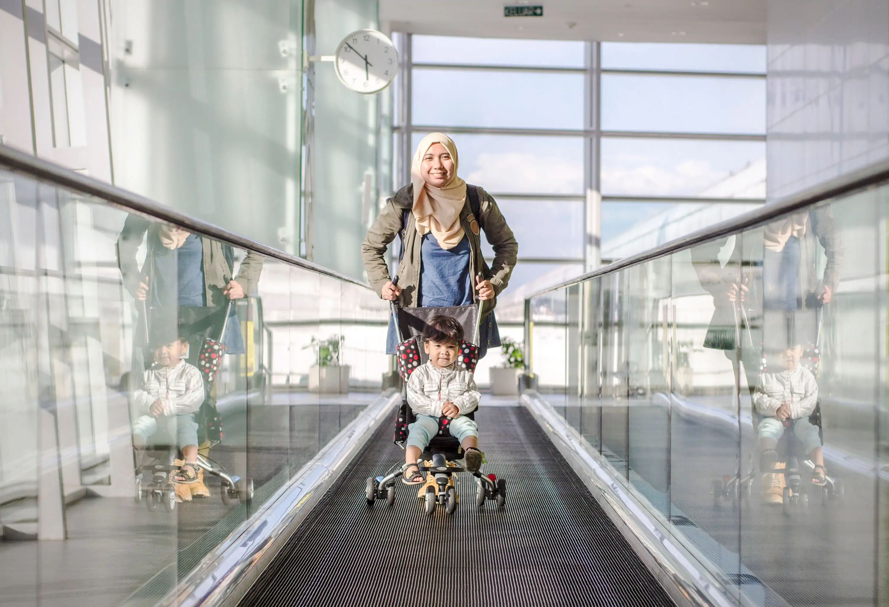 Muslim mother traveling with toddler at airport