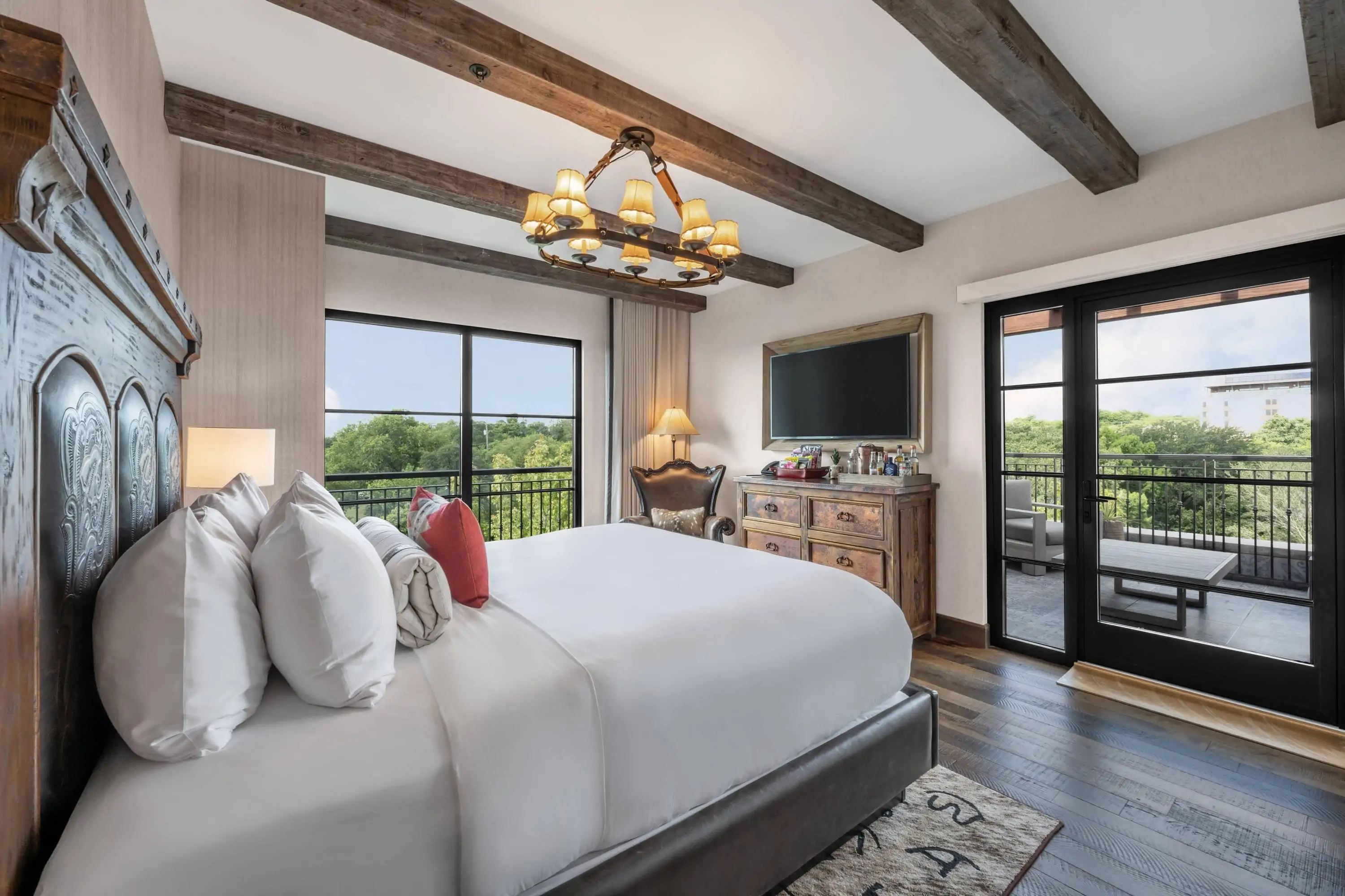 Rustic luxury hotel room with two windows and wooden beams