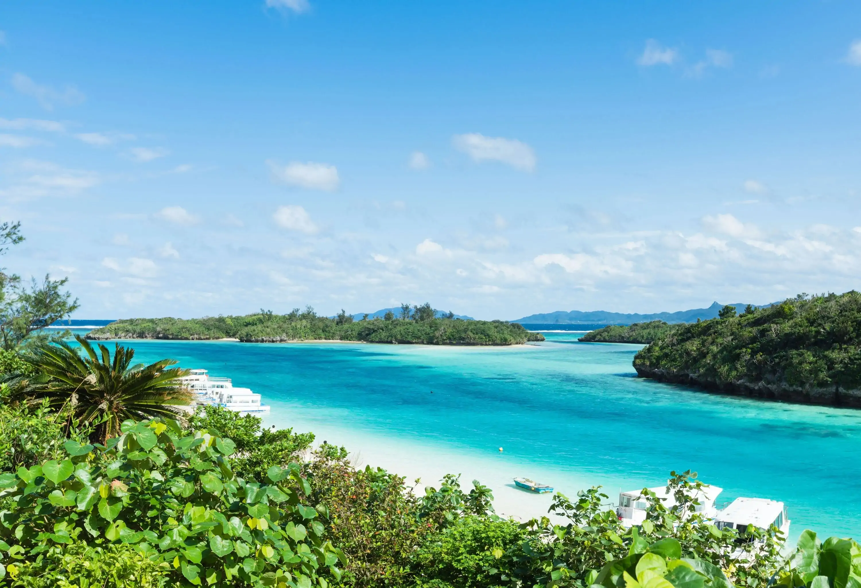 Clear blue water and rocks islands in a coral lagoon, Kabira Bay Beach, Ishigaki Island of the Yaeyama Islands, Okinawa, Japan