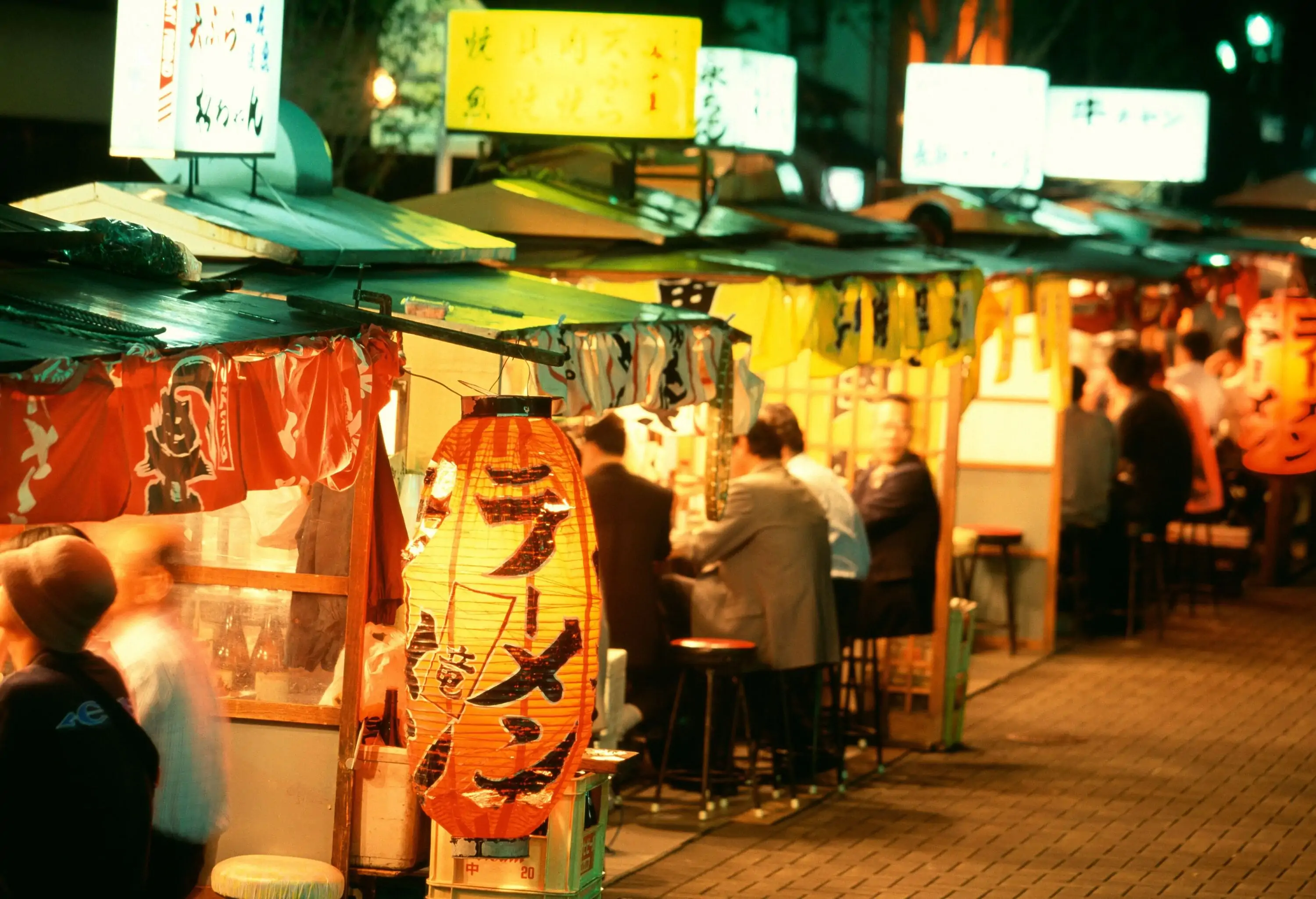 Food stalls of japanese food and people eating