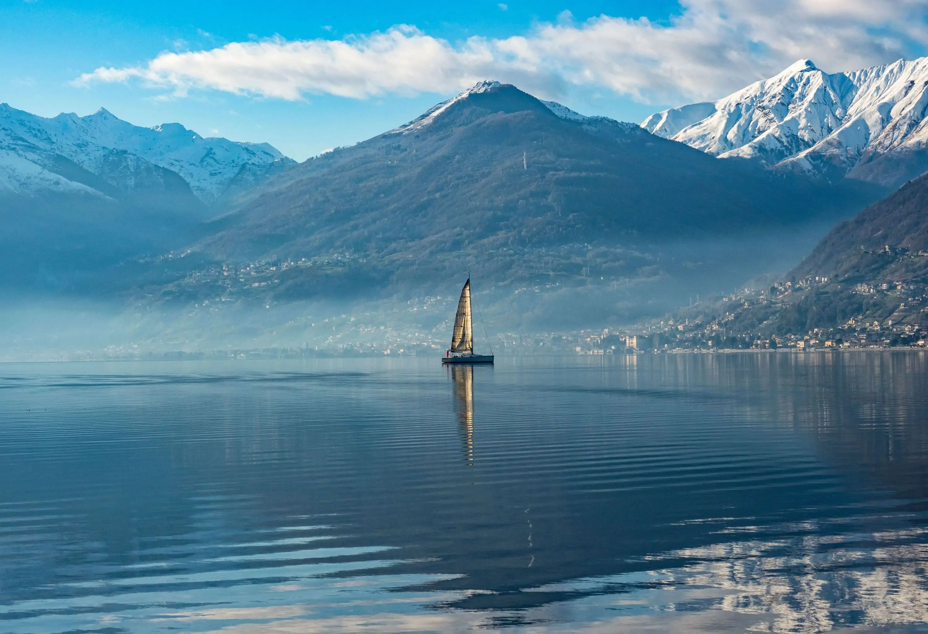Sailboat on Lake Como at morning hours