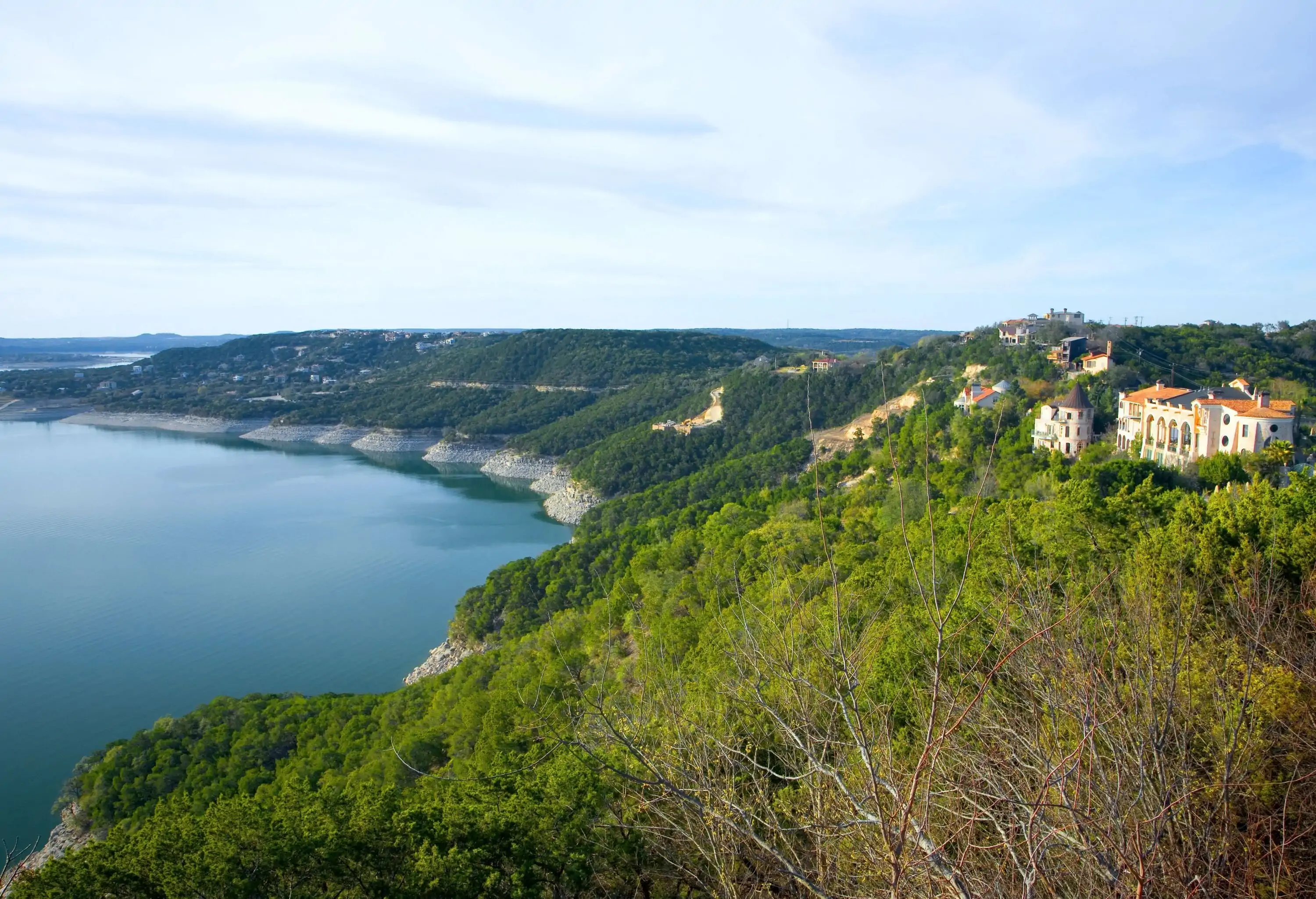 High angle view of a green rocky bay by the water