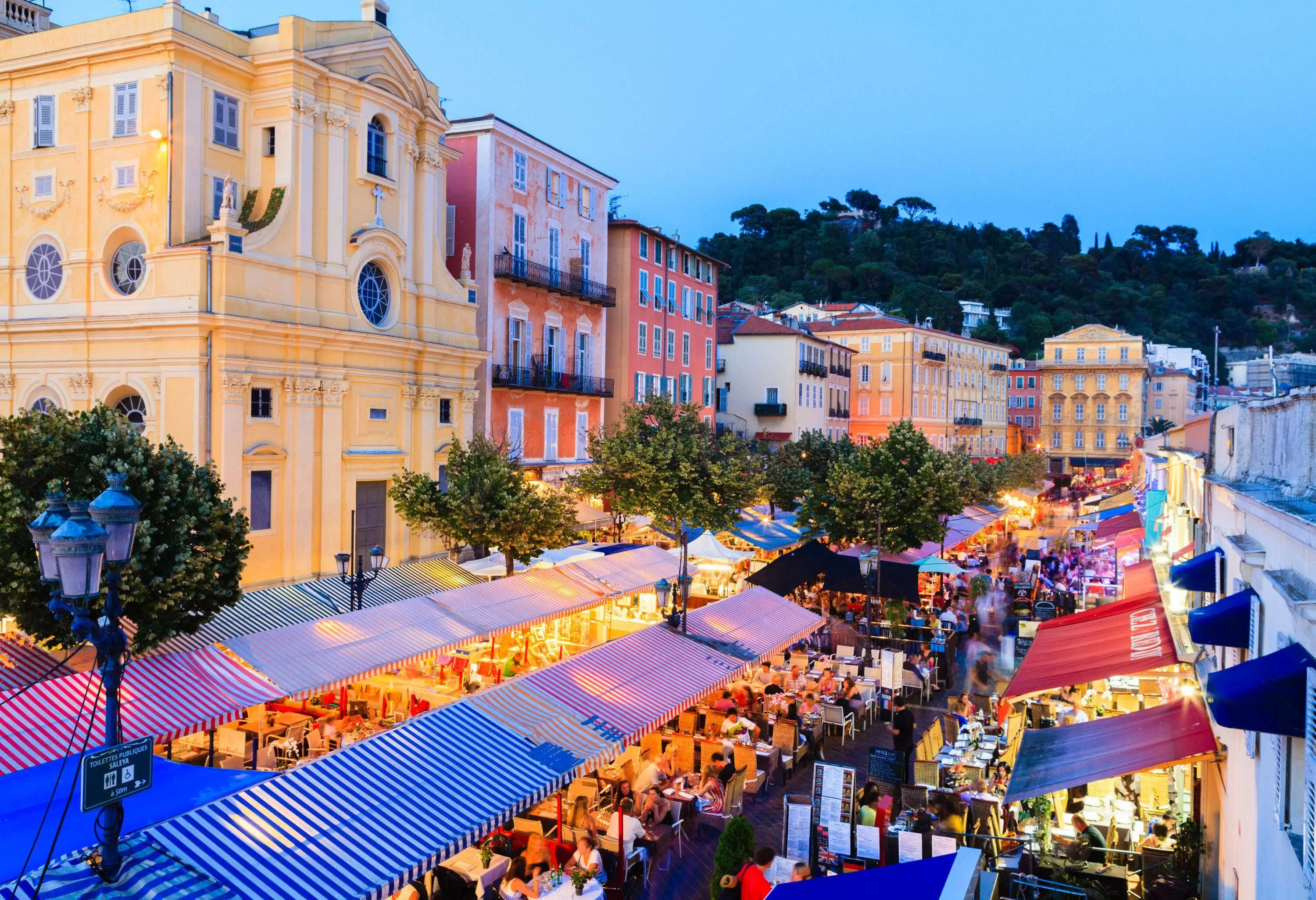 Aerial view of the crowded al fresco dining restaurants surrounded by classic colourful buildings.