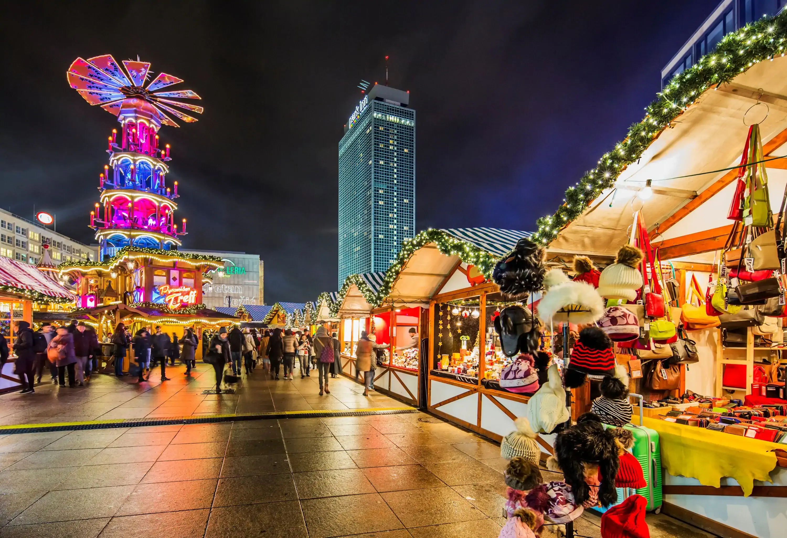 Germany, Berlin, Berlin . Alexanderplatz Christmas Market, on the background illuminated tall hotel building