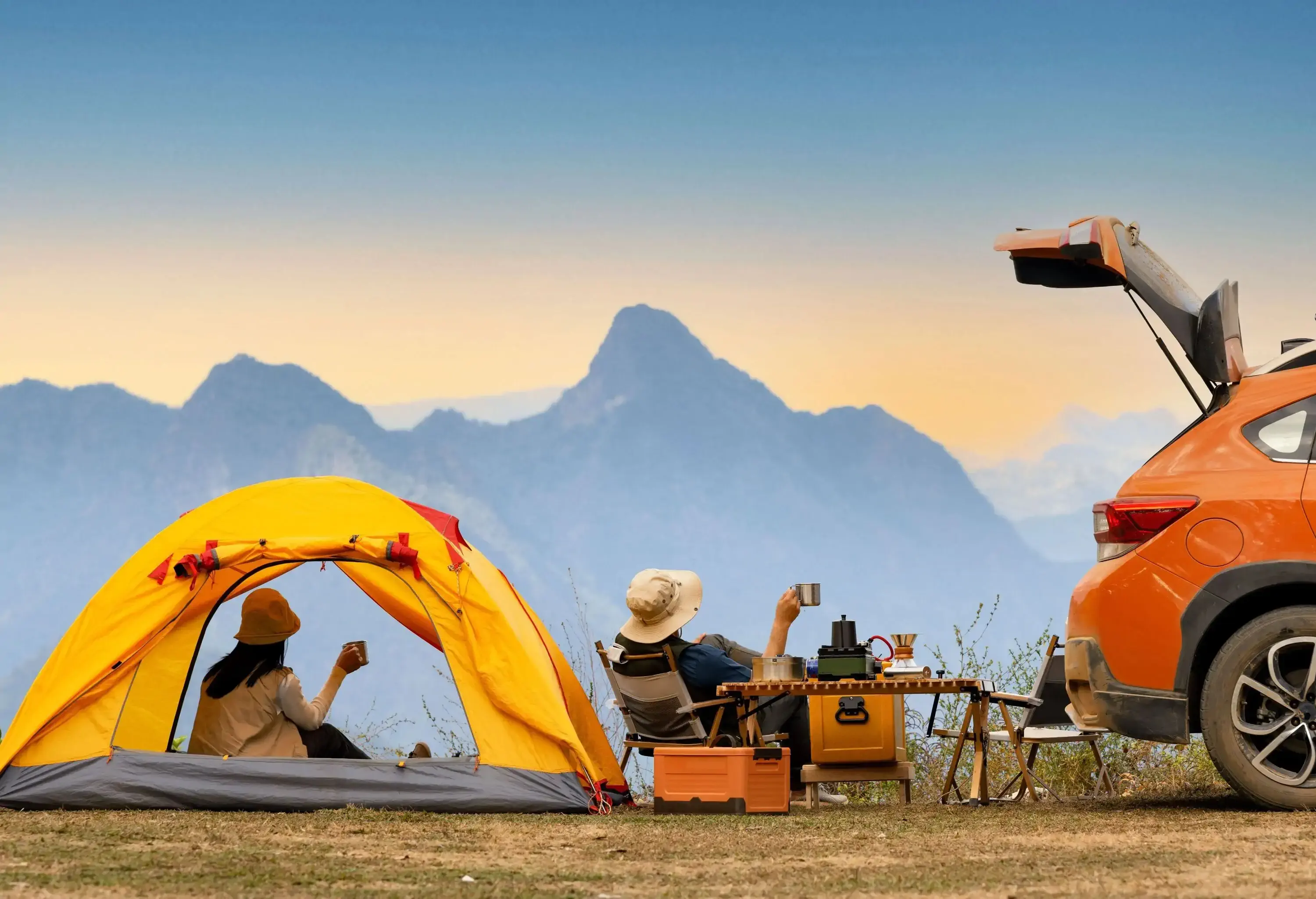 Camping in the wild with a beautiful sunset in the background