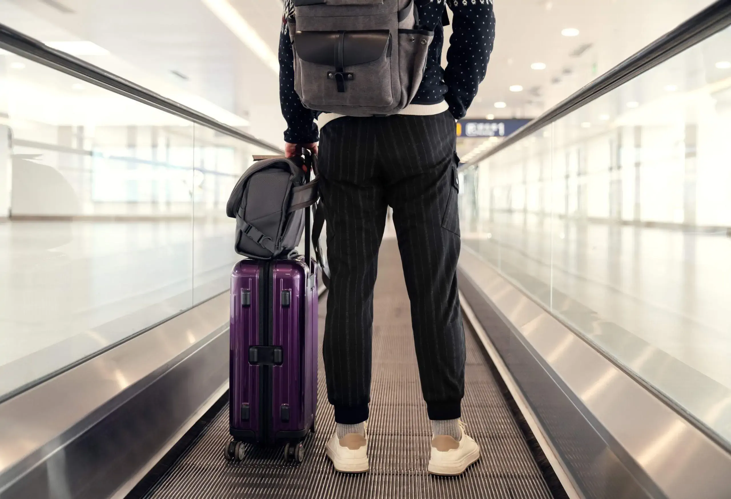 Passenger walking in the airport terminal.