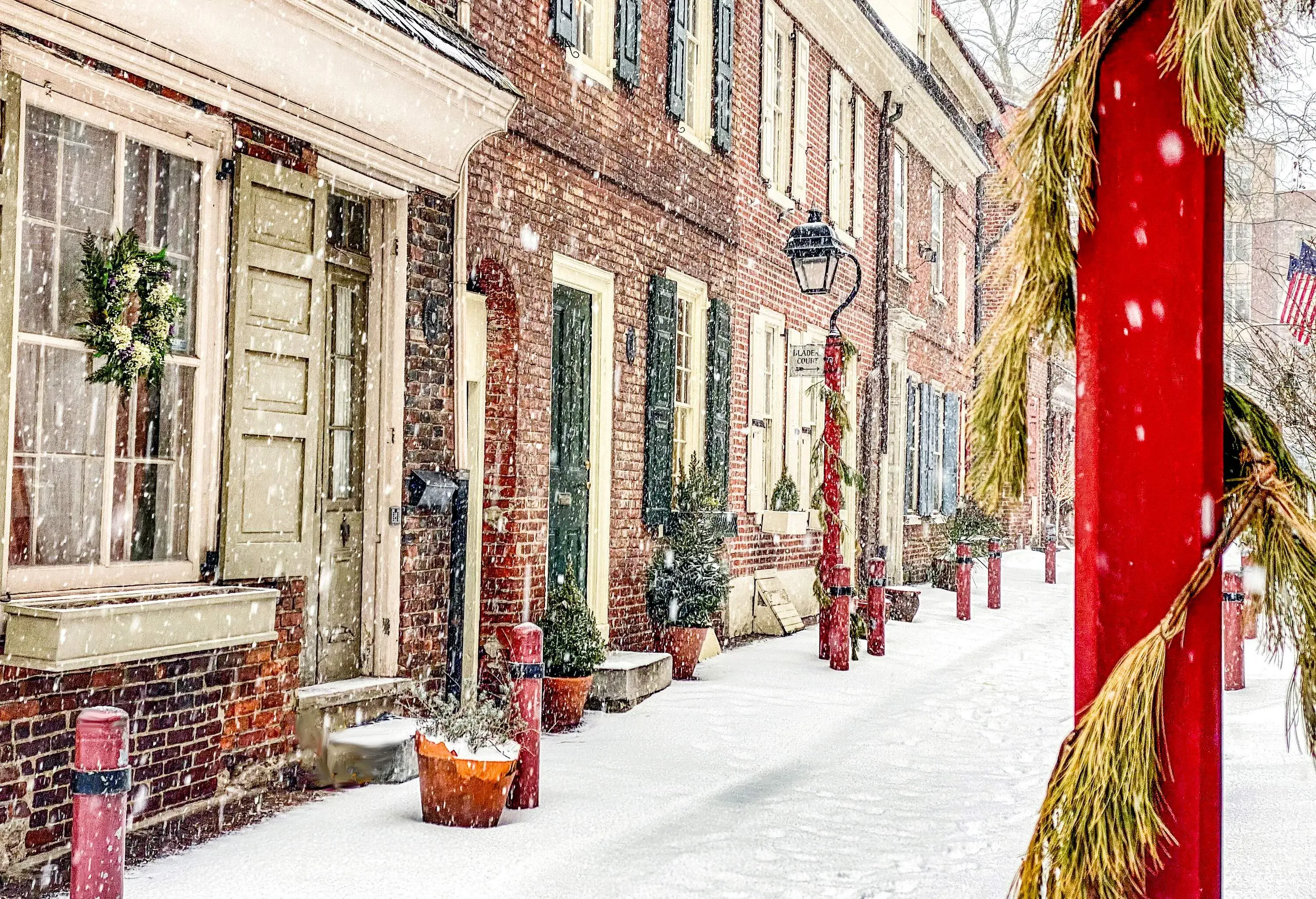 Center city Philadelphia. Elfreth Alley street in the winter, covered with white snow.