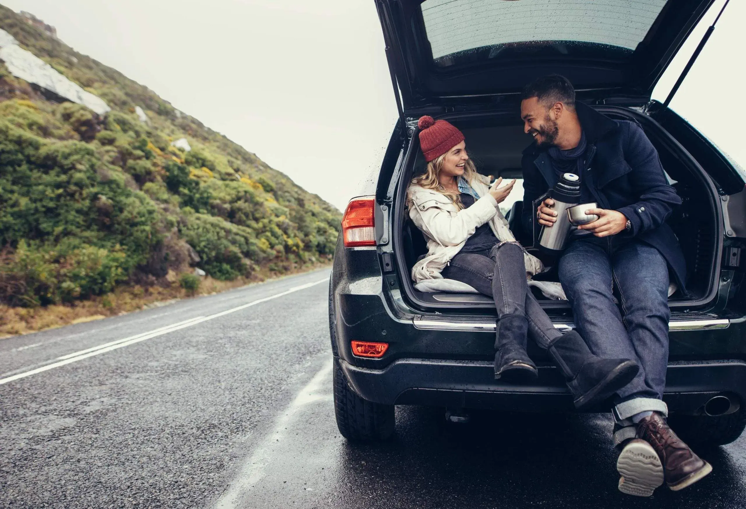 theme_car_people_couple_driving_roadtrip-shutterstock-portfolio_701022709-scaled