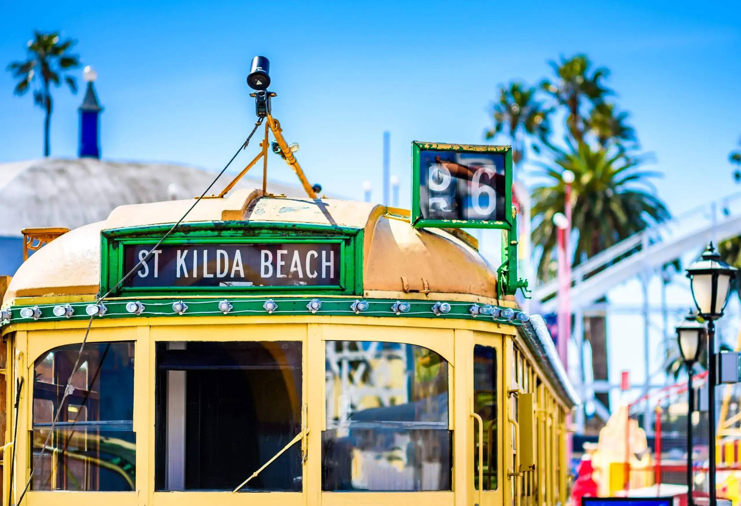 A yellow vintage tram signage that reads