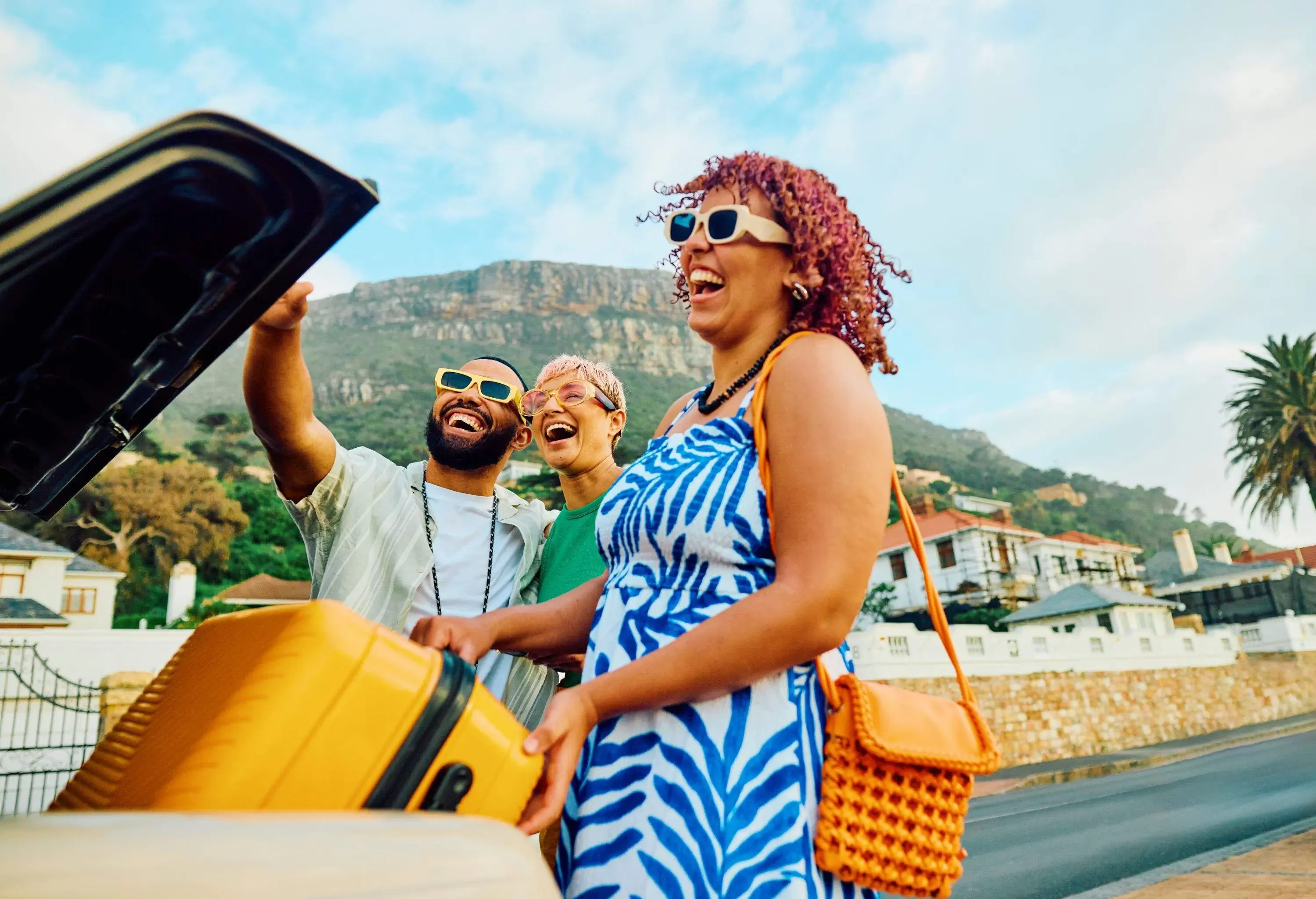 Three happy friends capture a cheerful moment with a selfie during their travel adventure