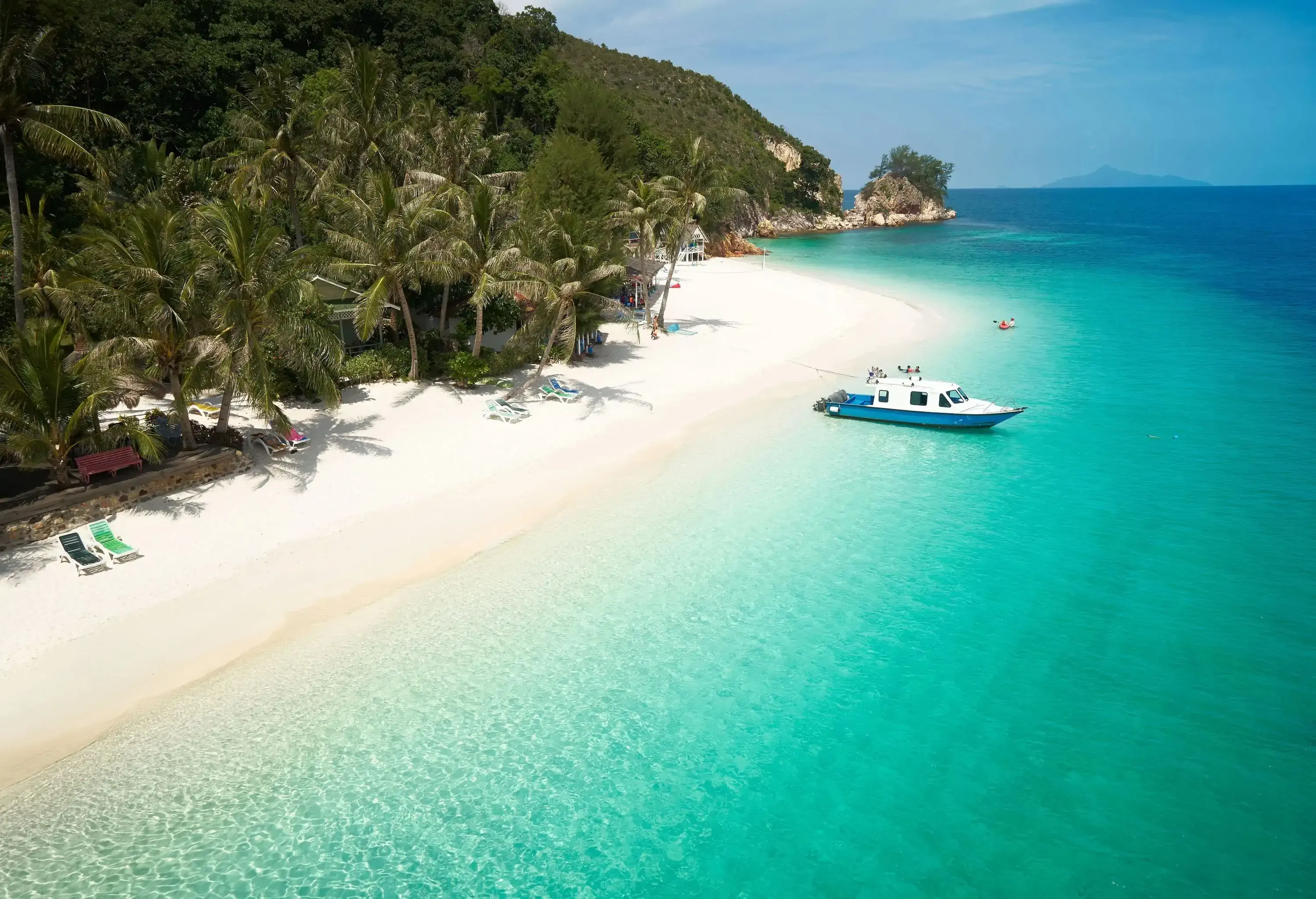 Beautiful beach aerial view over a Rawa island. White sandy beach seen from above.