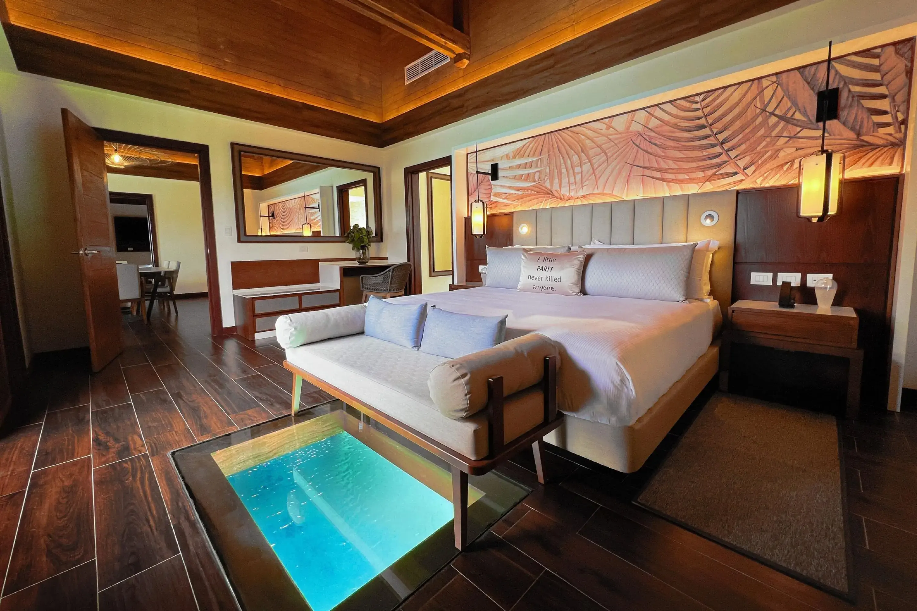 Modern luxury hotel room with window into the ocean bottom