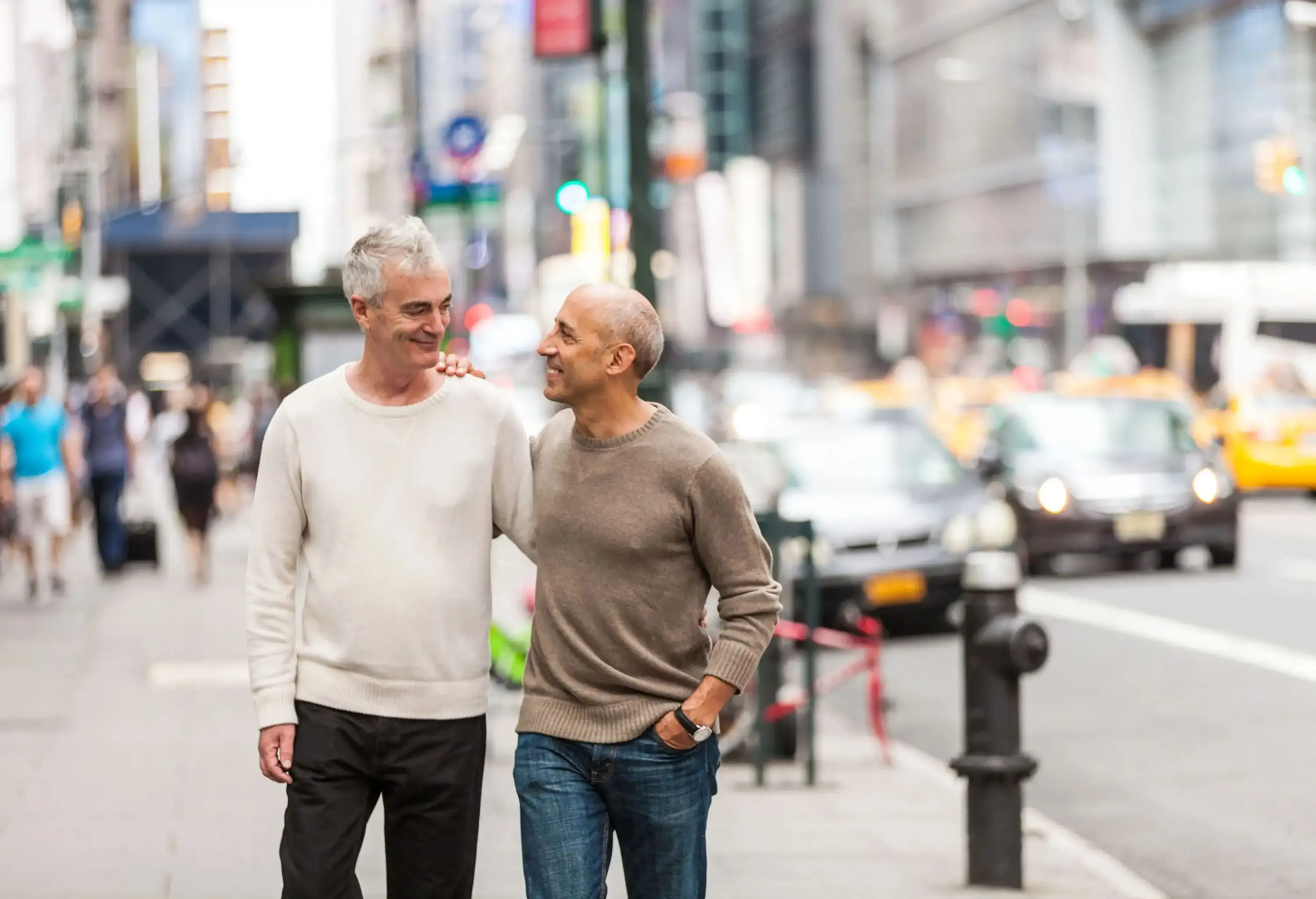 Middle aged gay couple walking in the streets in New York city
