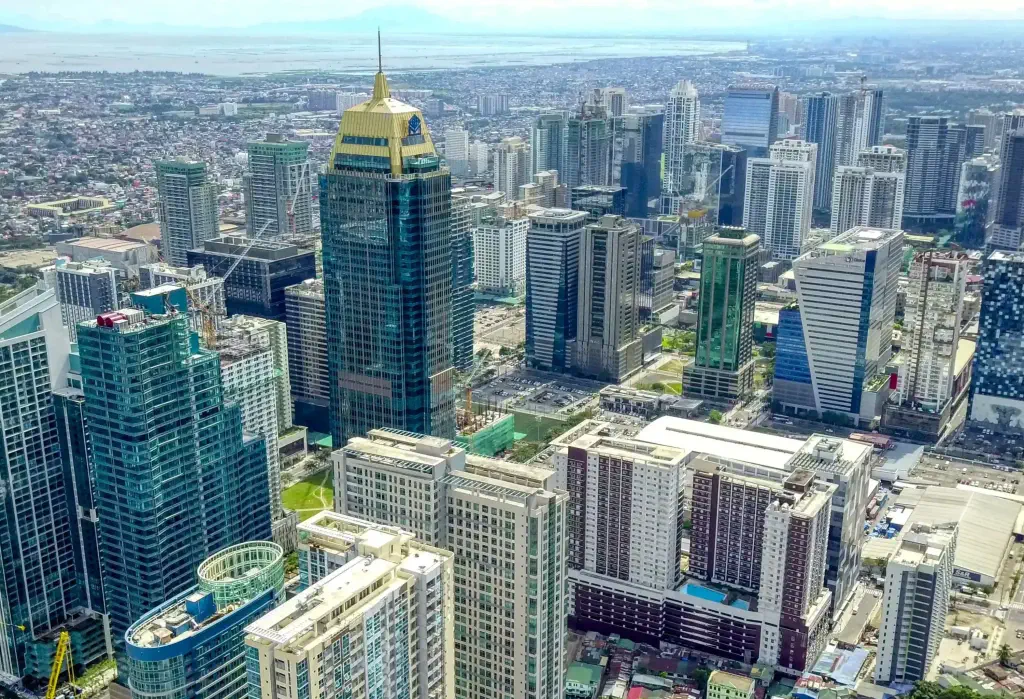 Aerial view of a modern city with towering skyscrapers.
