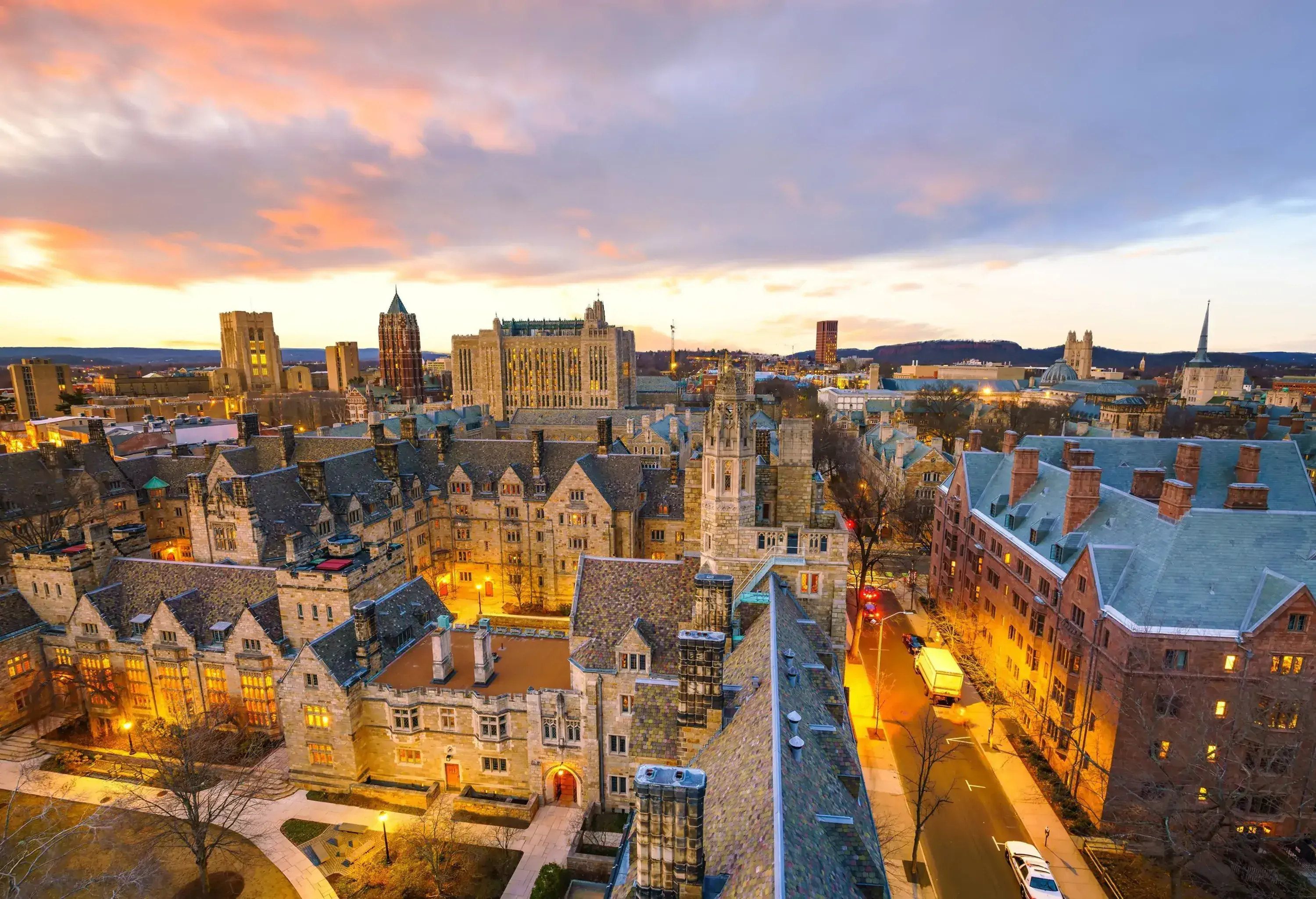 Historical buildings stand as a captivating landmark amidst the vibrant downtown area, harmoniously complemented by the esteemed Yale University campus, fusing heritage and academia in the heart of the city.