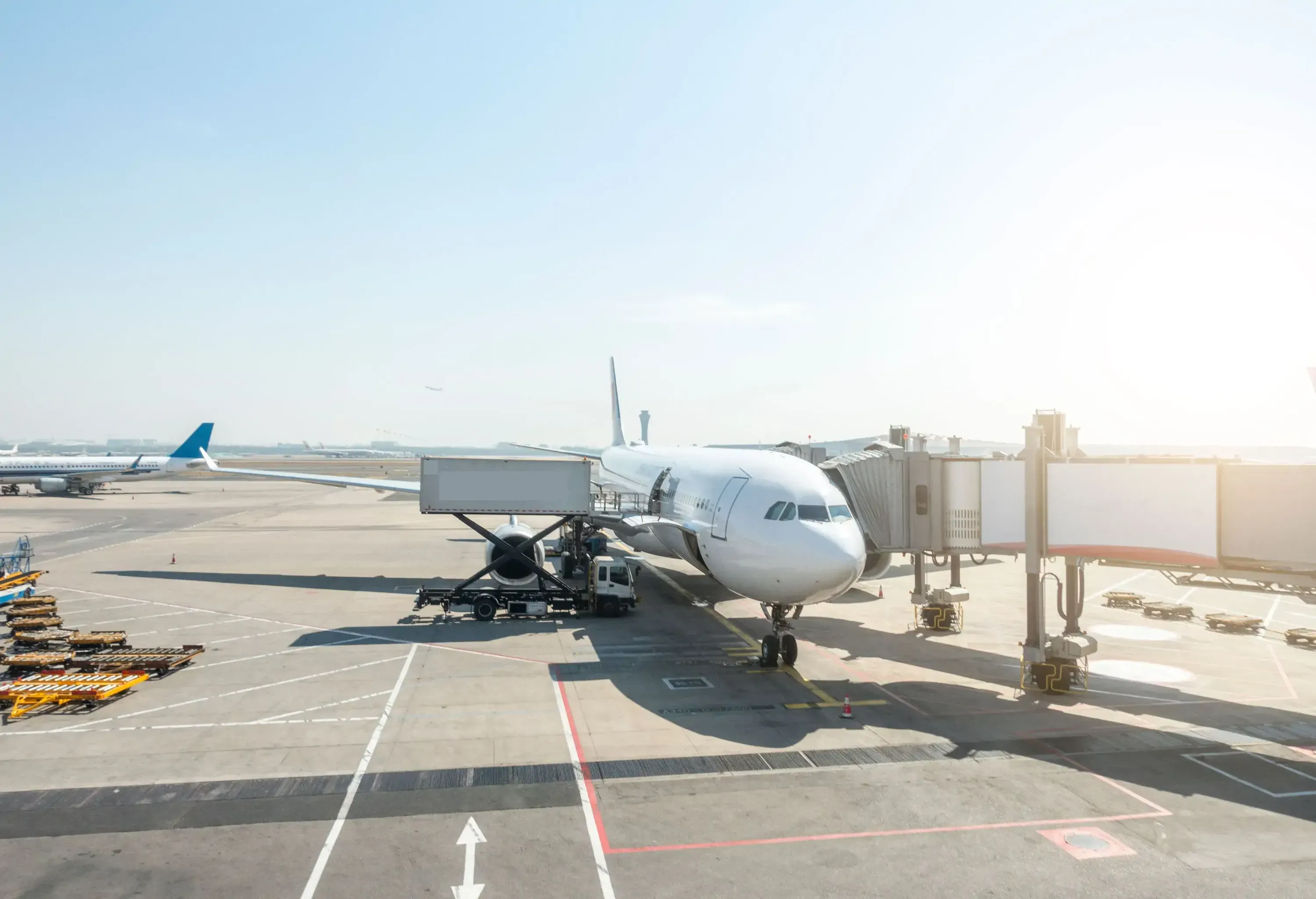 Plane parked at its dock at an airport