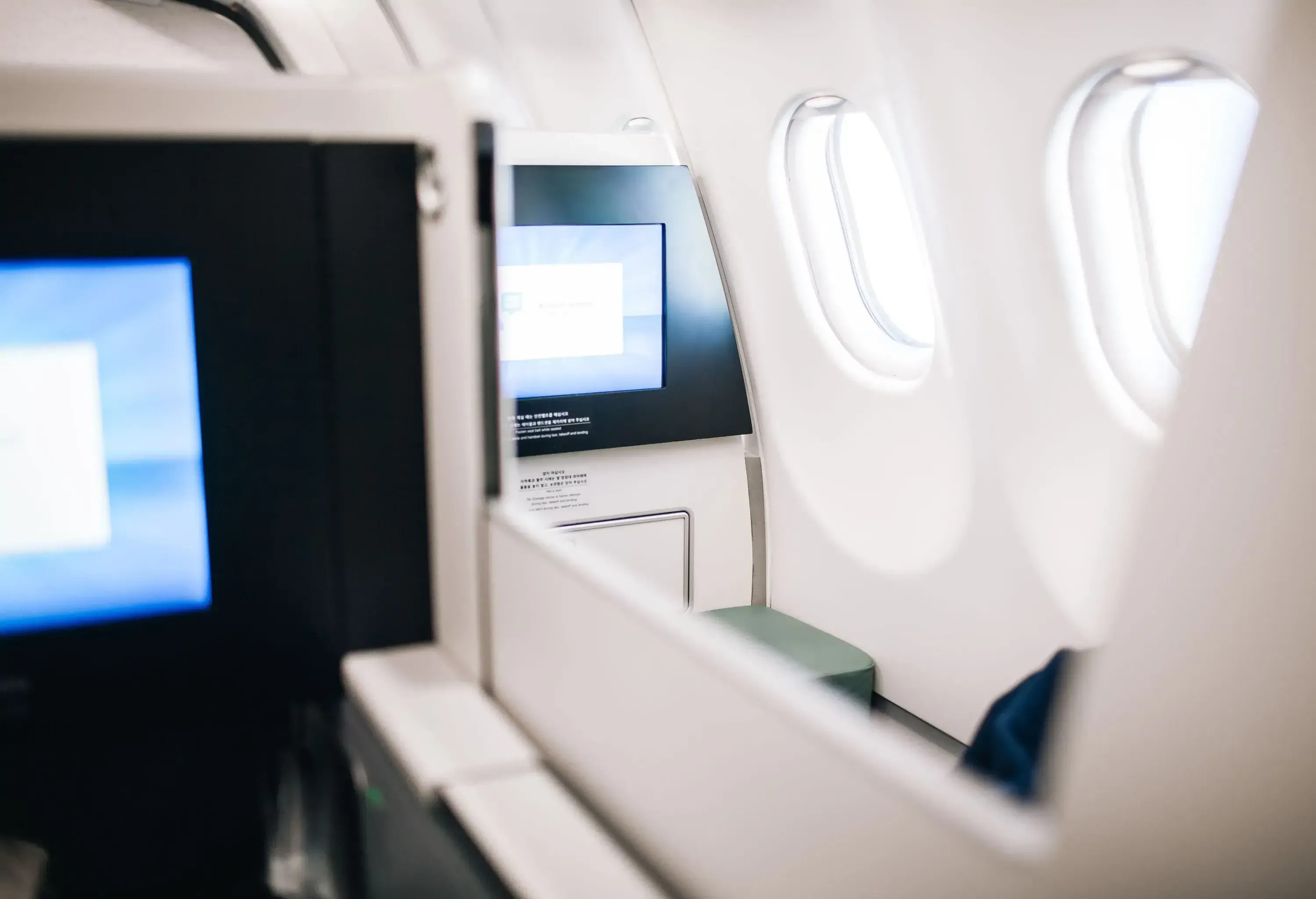 Shot inside business class passenger cabin in a modern aircraft.