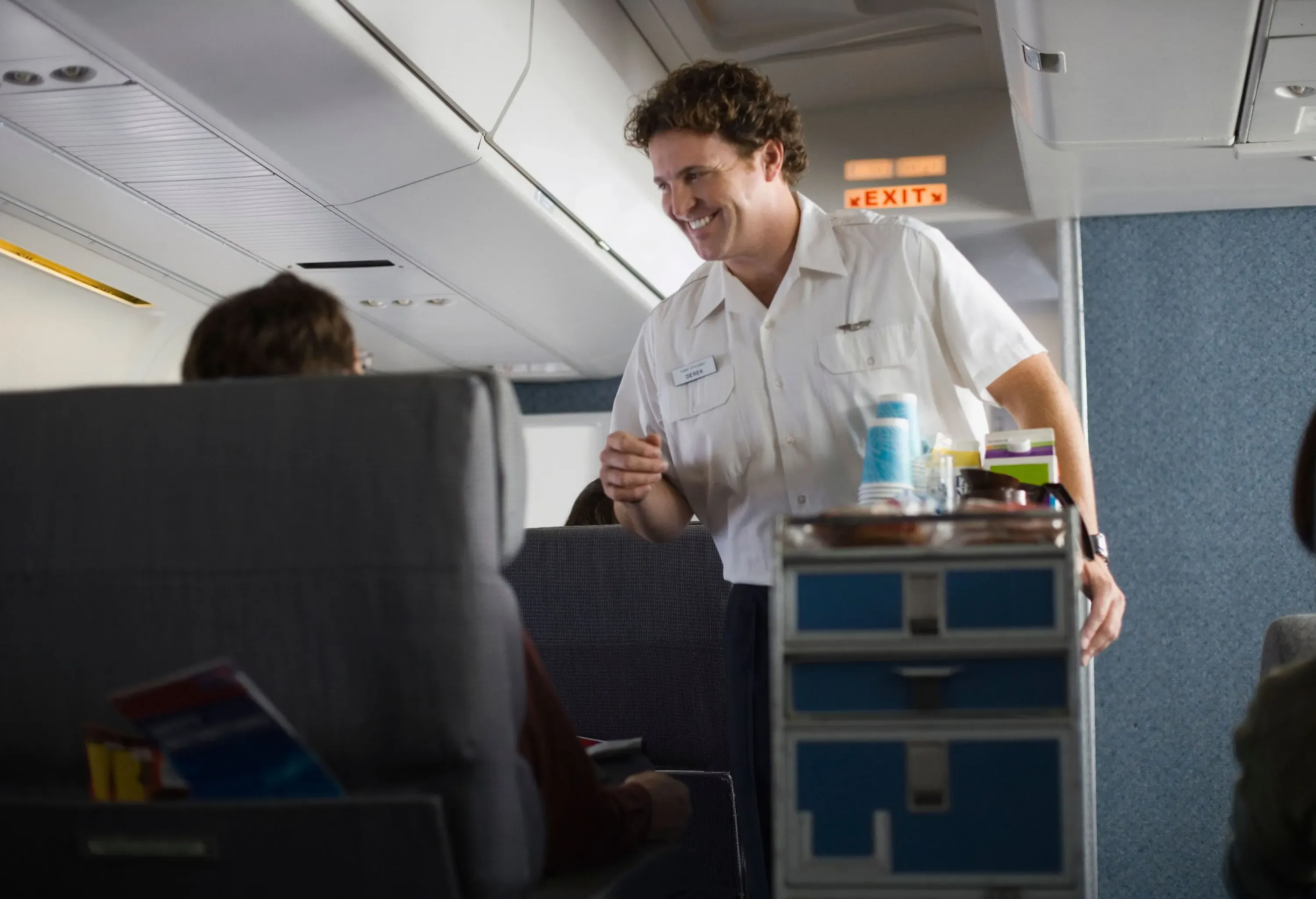 Smiling first class cabin crew