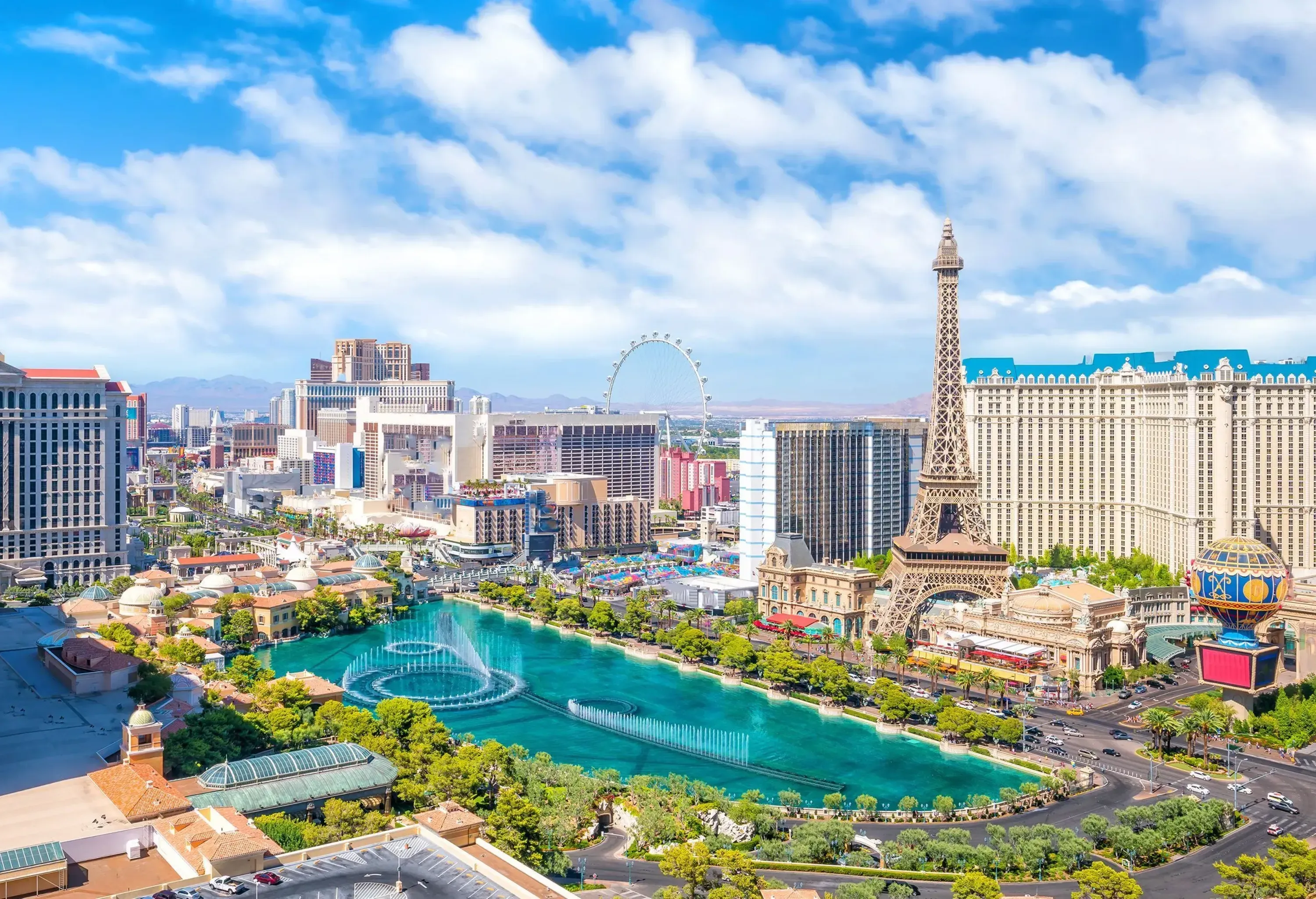 The Las Vegas Strip features a captivating skyline with a variety of towering buildings, including sleek modern high-rises, themed resorts, and even a replica of the Eiffel Tower, creating a mesmerising and opulent cityscape.