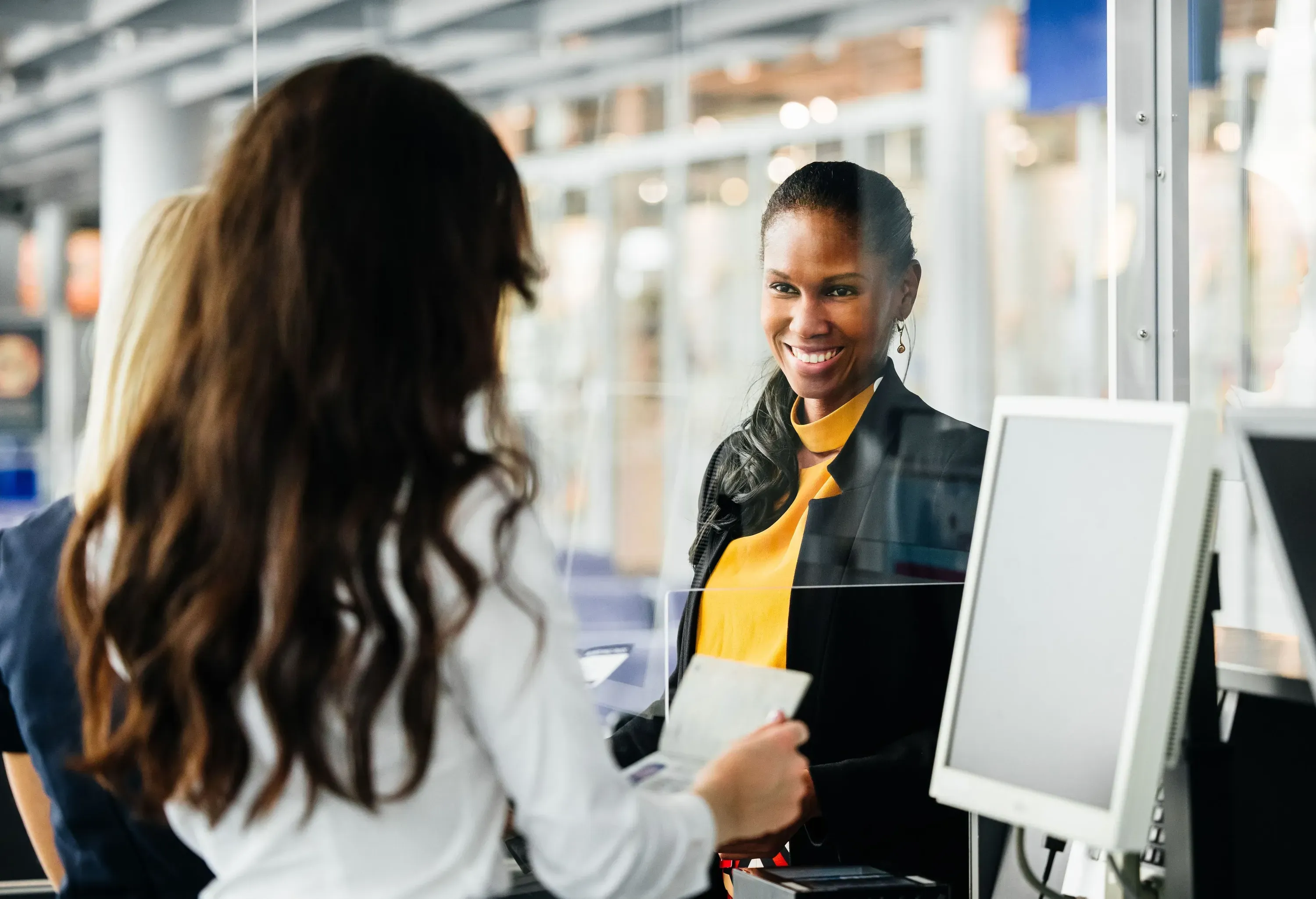 A woman arriving at the get to get checked in and board the plane