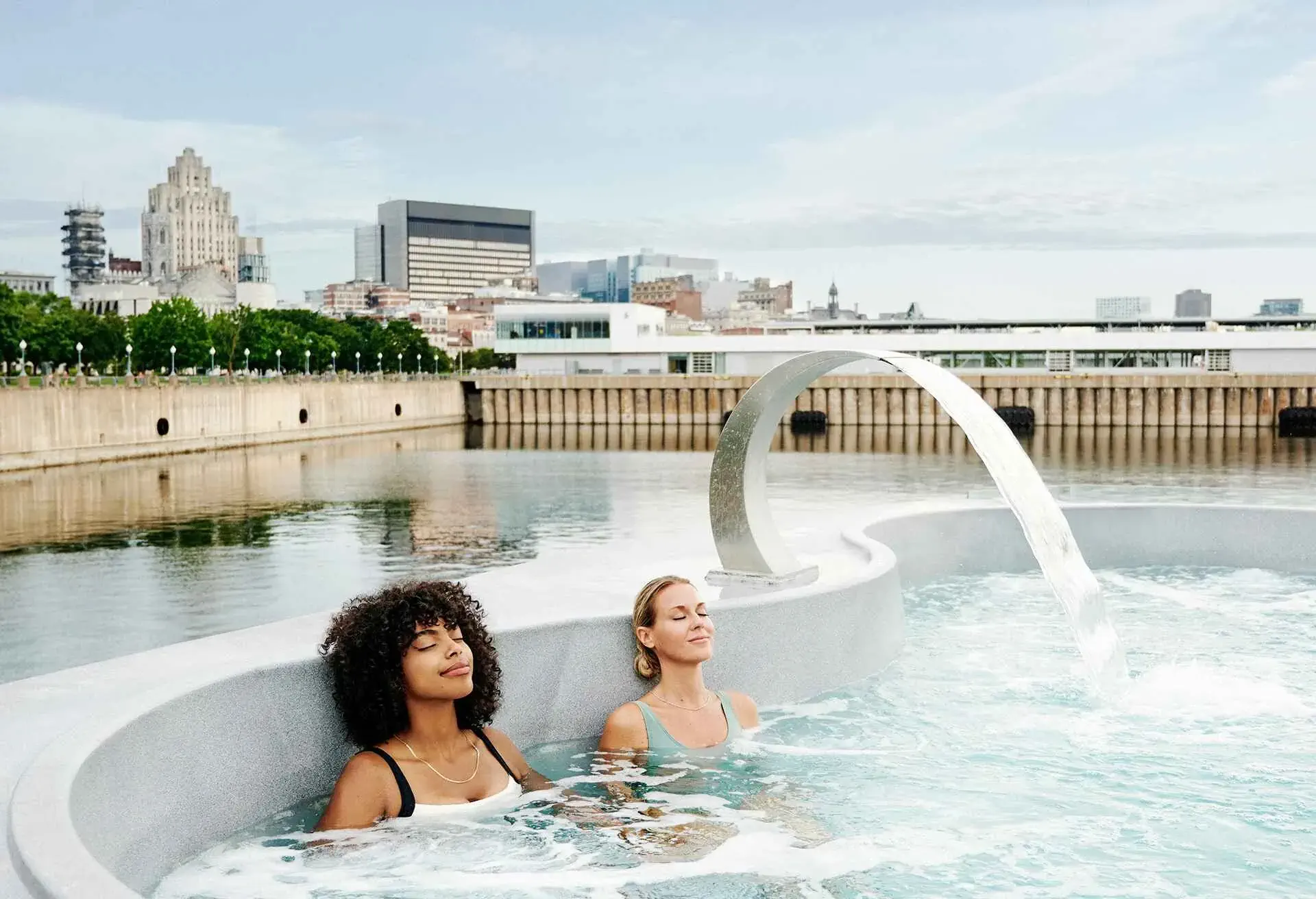 two women enjoying a spa pool