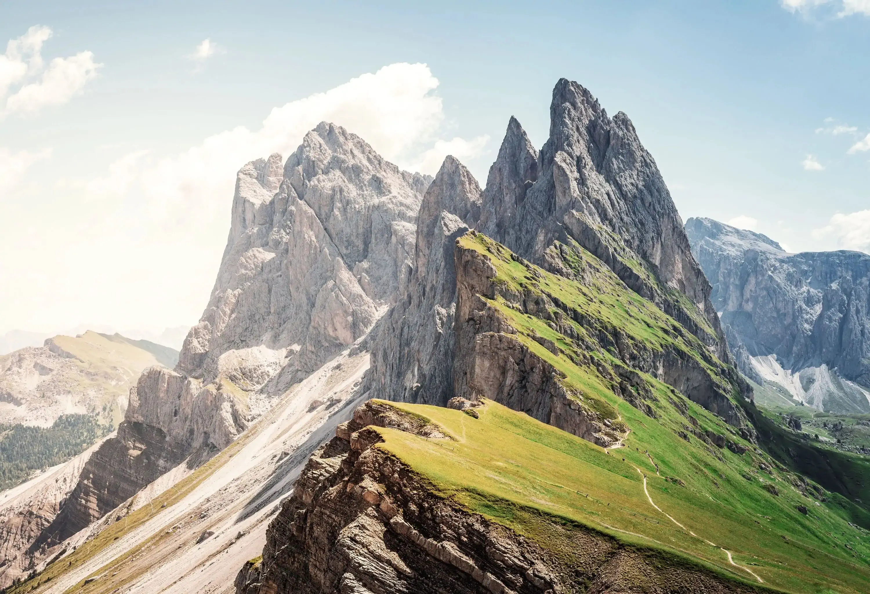 The sharp-pointed peak of a mountain reaching the sky.